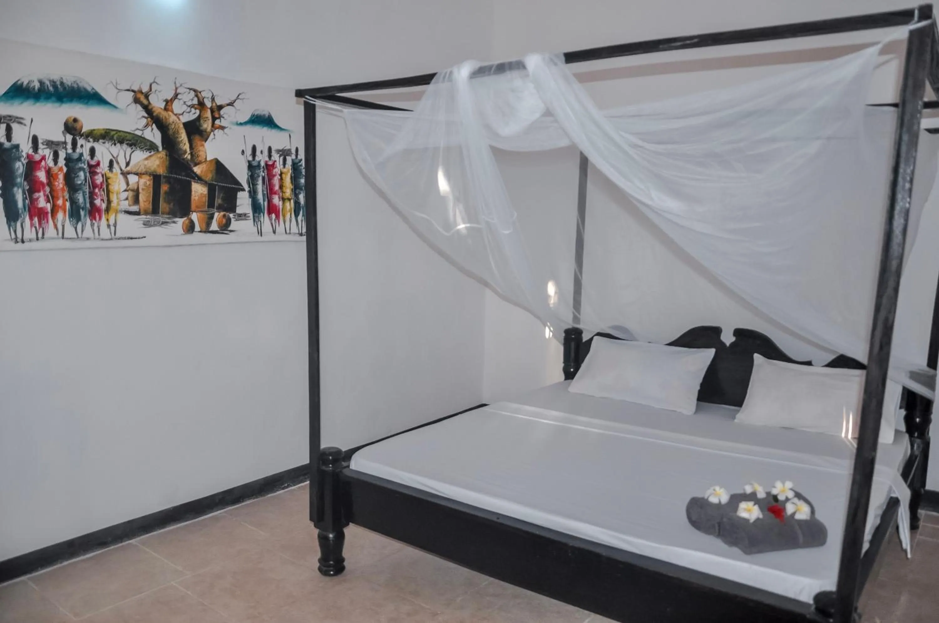 Bed in Papaya Guest House Nungwi