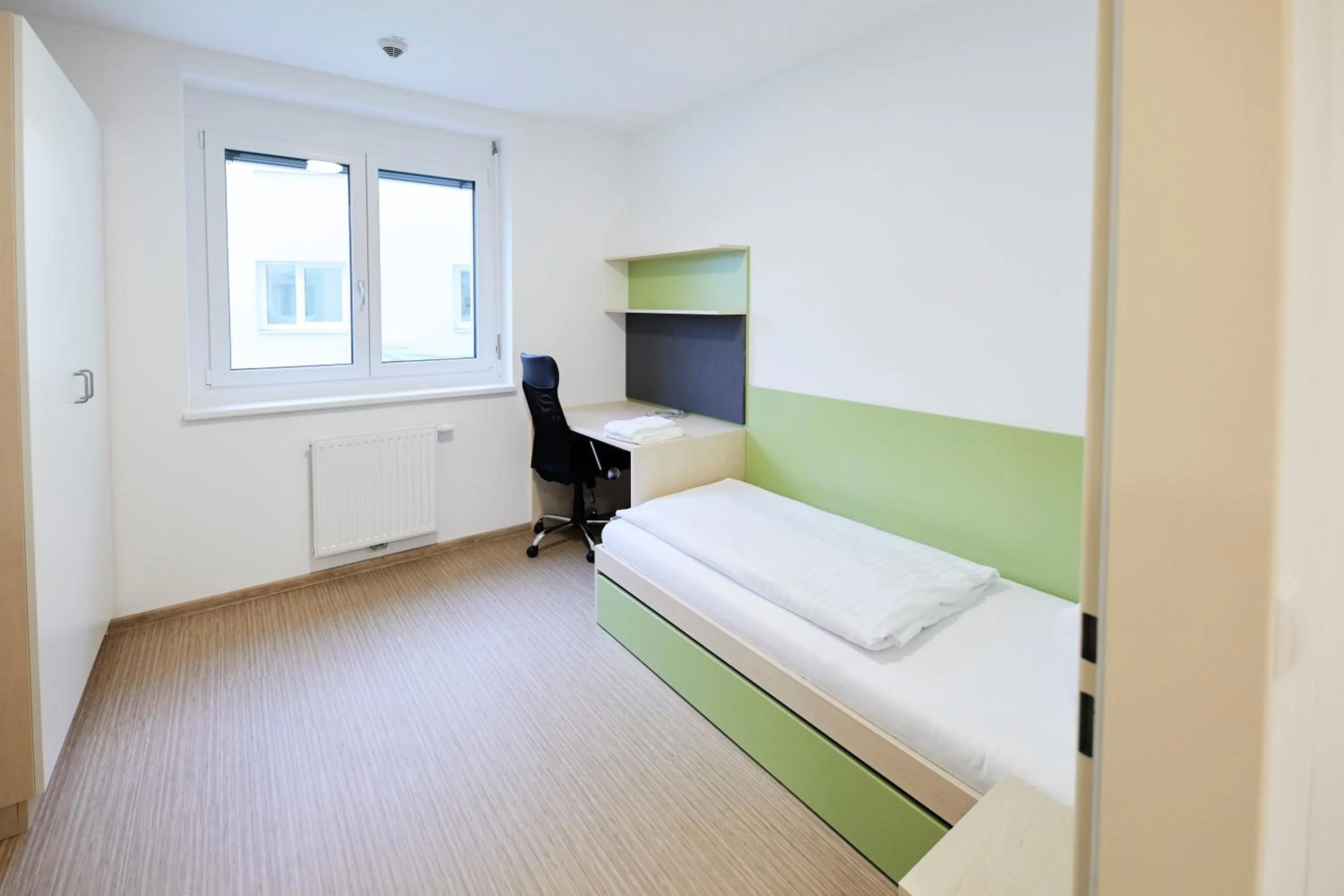 Bed in I AM HOTEL Leoben