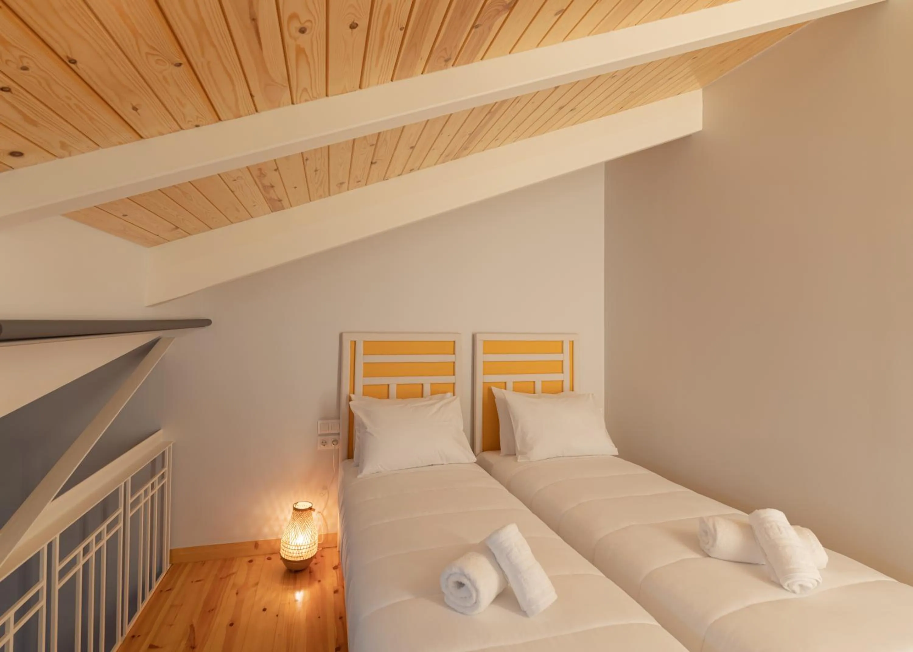 Bed in Ether Loft Suites