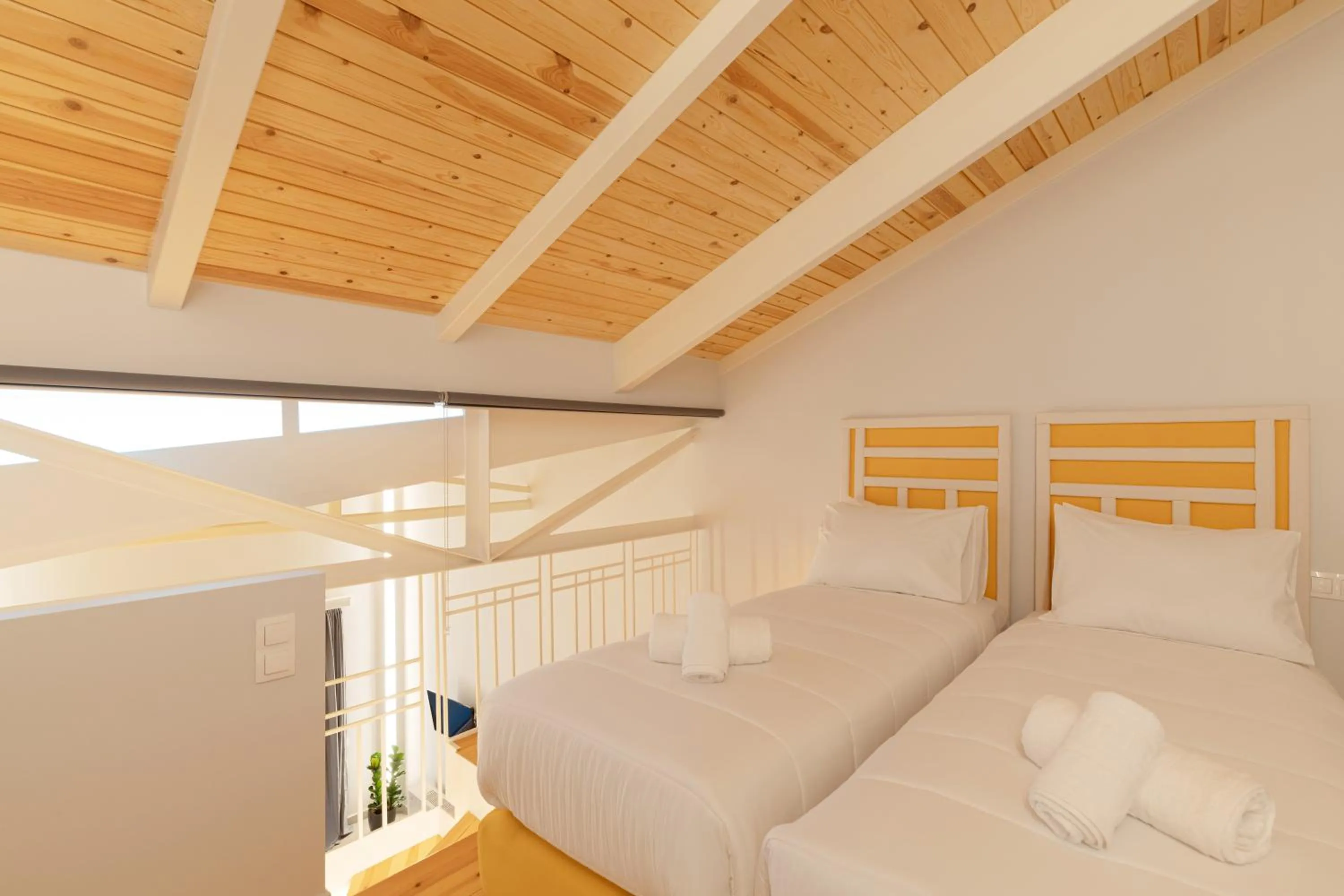 Bed in Ether Loft Suites
