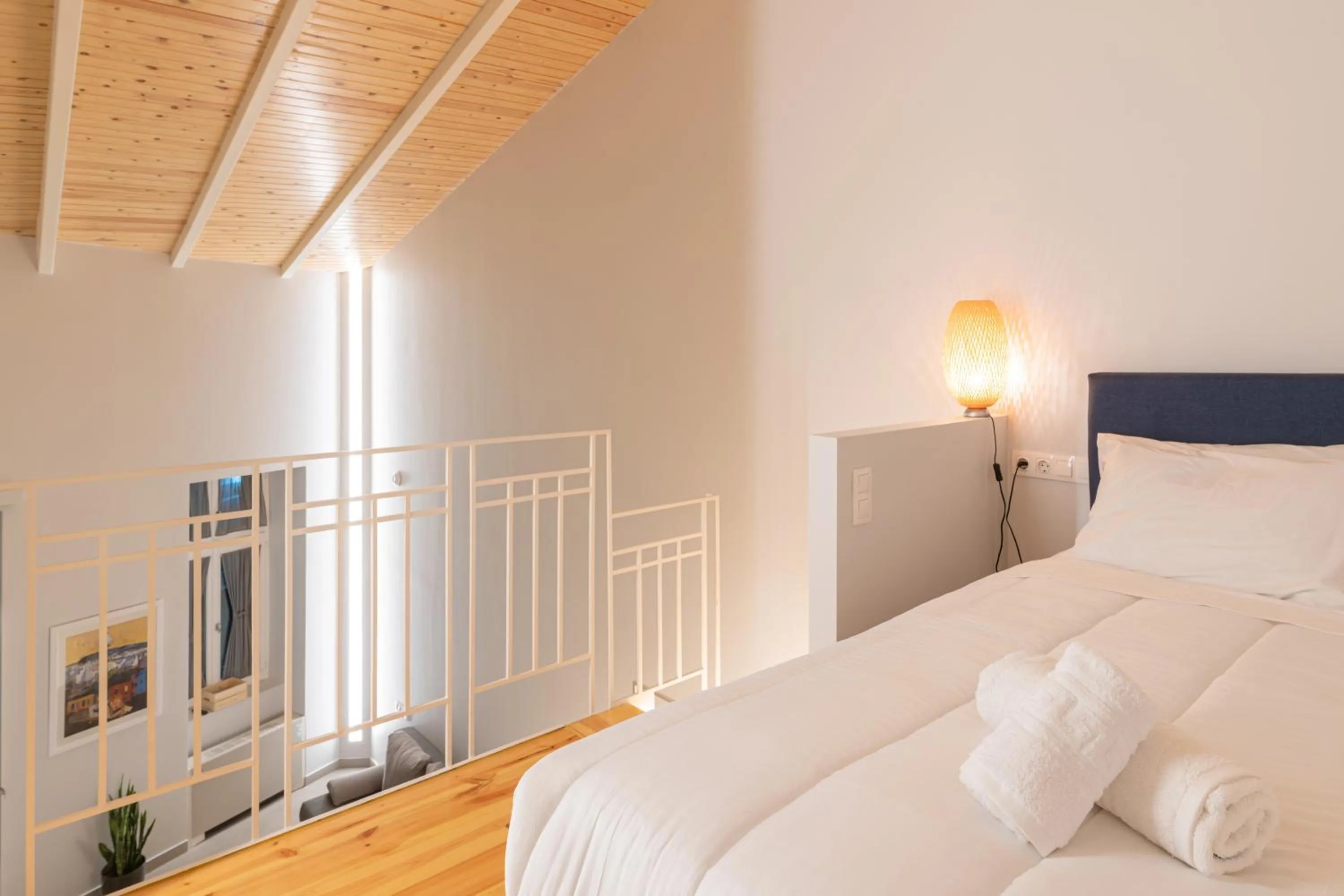 Bed in Ether Loft Suites