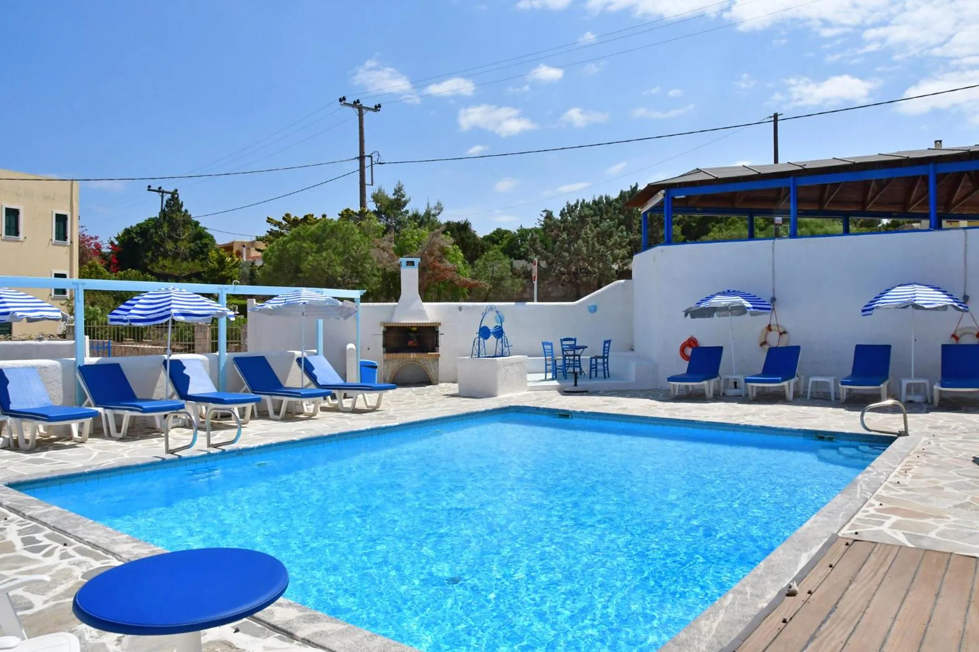 Swimming pool in Blue Dolphin Studios and Apartment