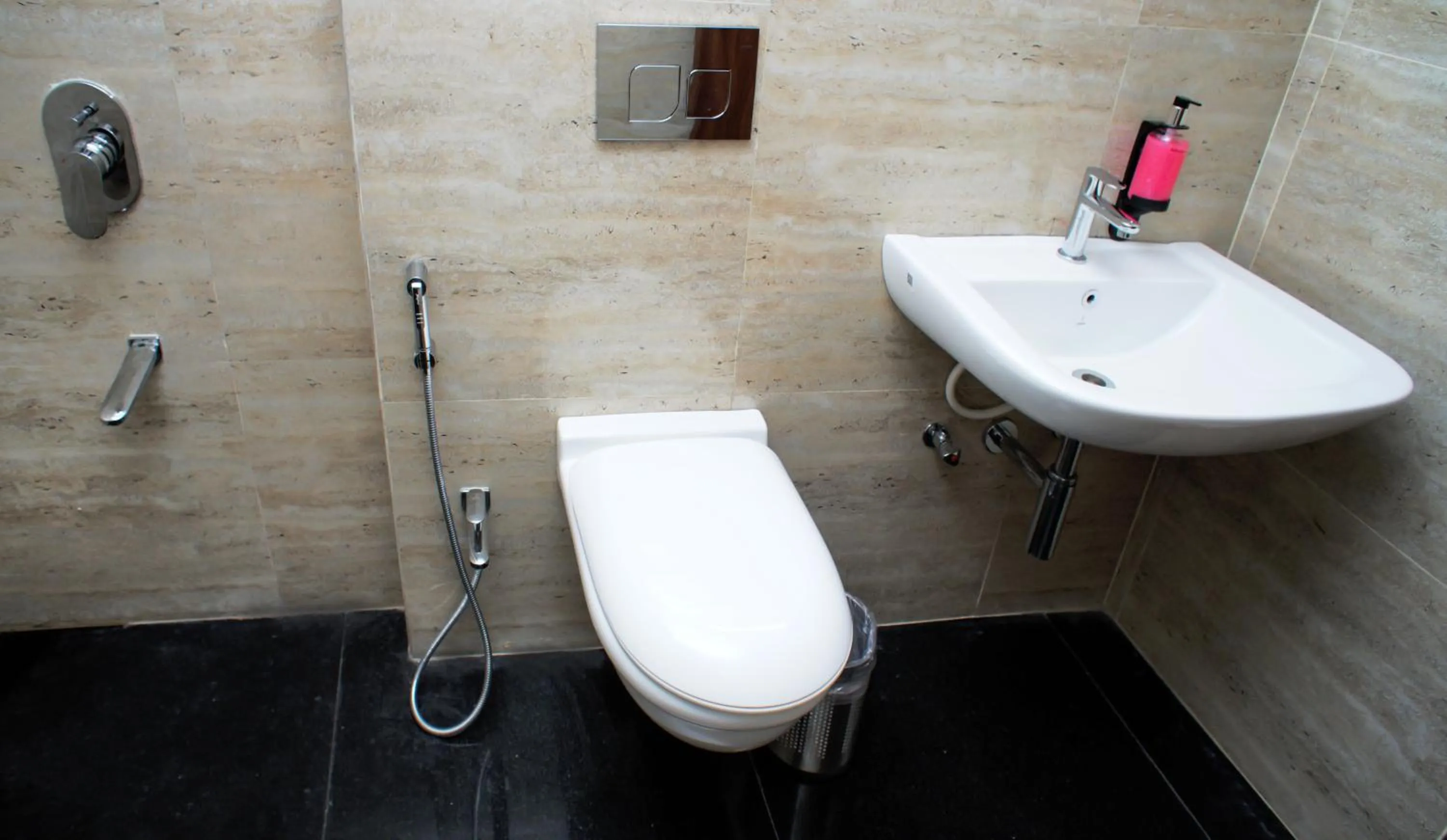 Bathroom in Mastiff Hotel Chinchwad by OTHPL