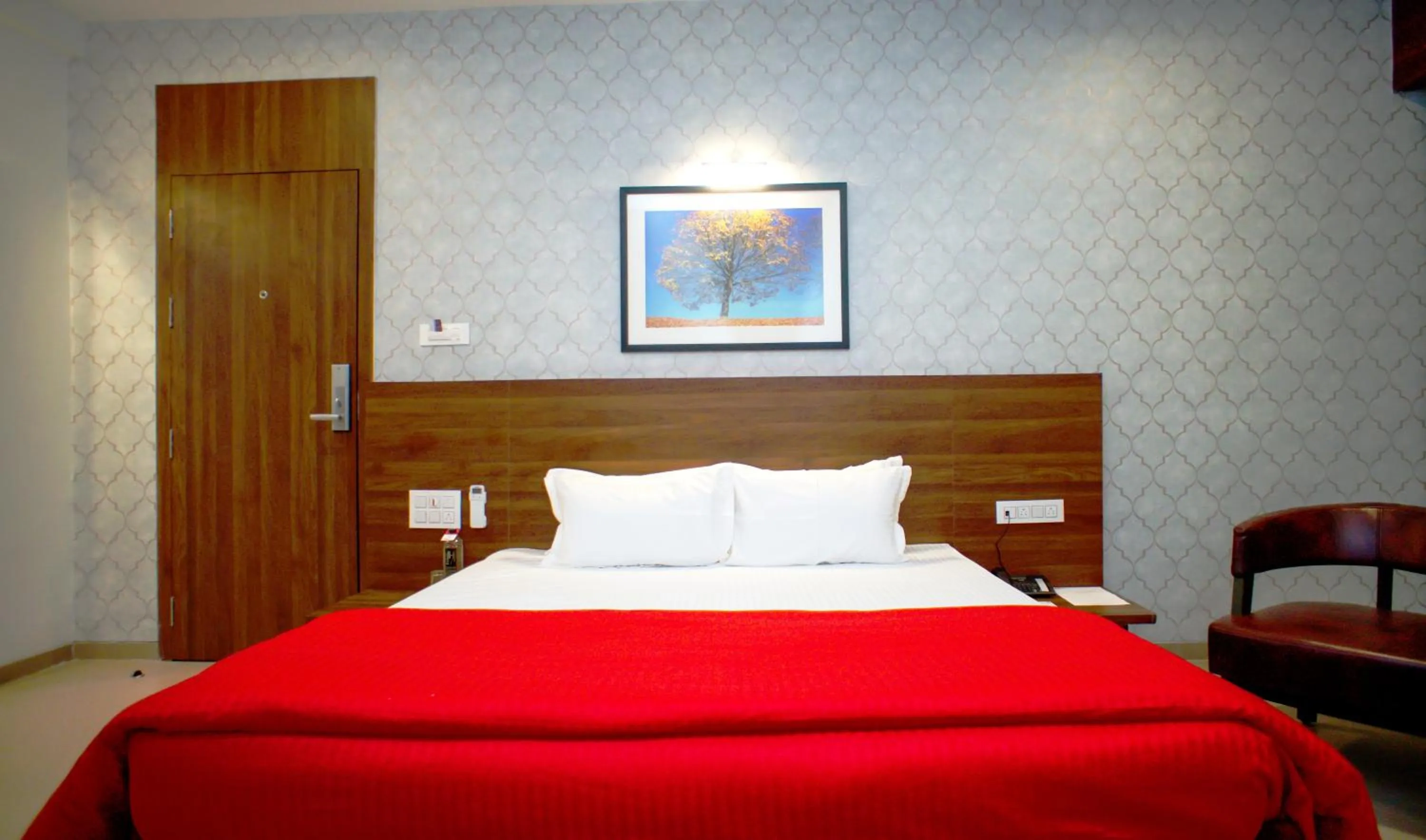 Bedroom, Bed in Mastiff Hotel Chinchwad by OTHPL