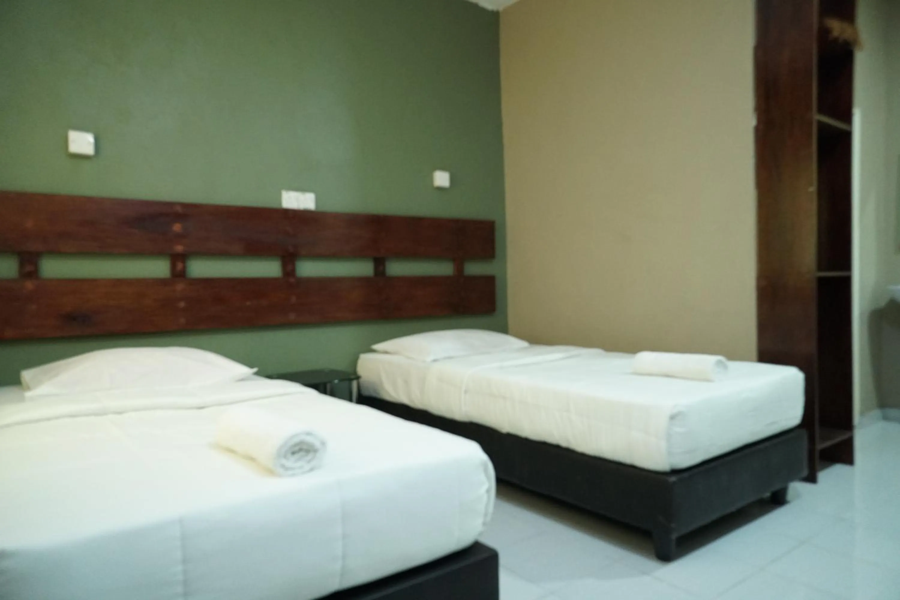 Bed in Pondok Muara Chalet