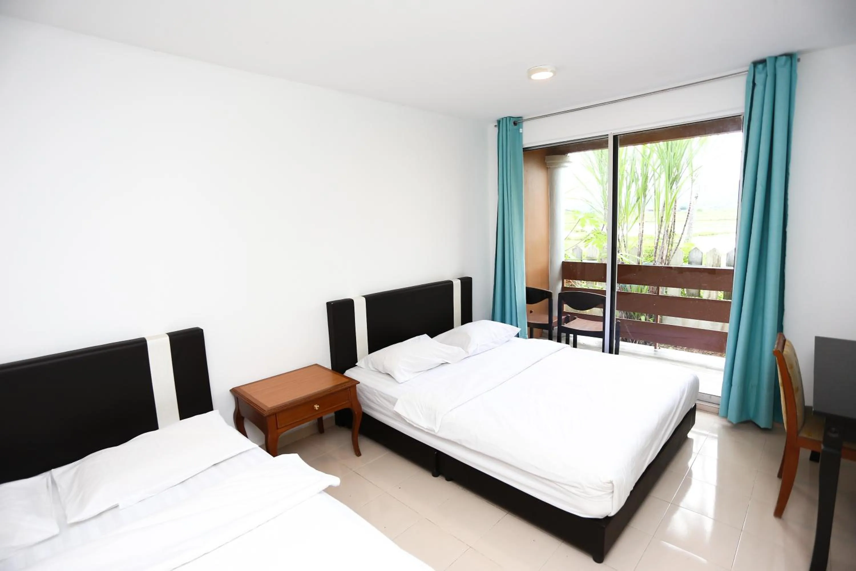 Bed in Pondok Muara Chalet