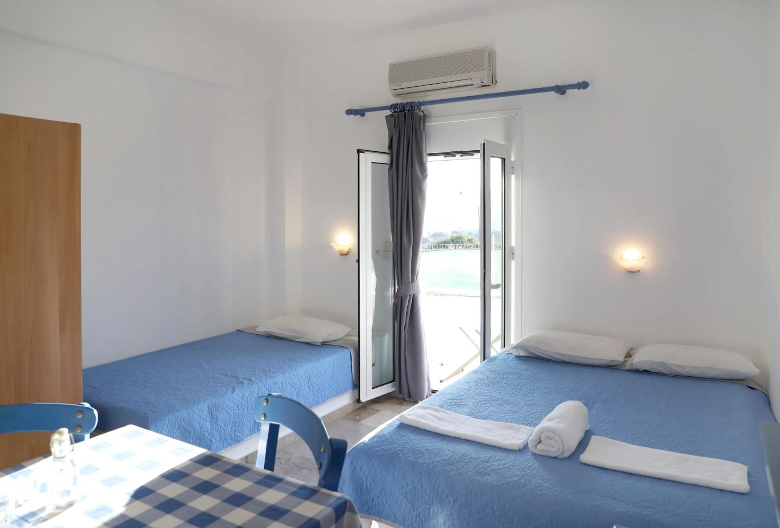 Bed in Helios Studios & Apartments