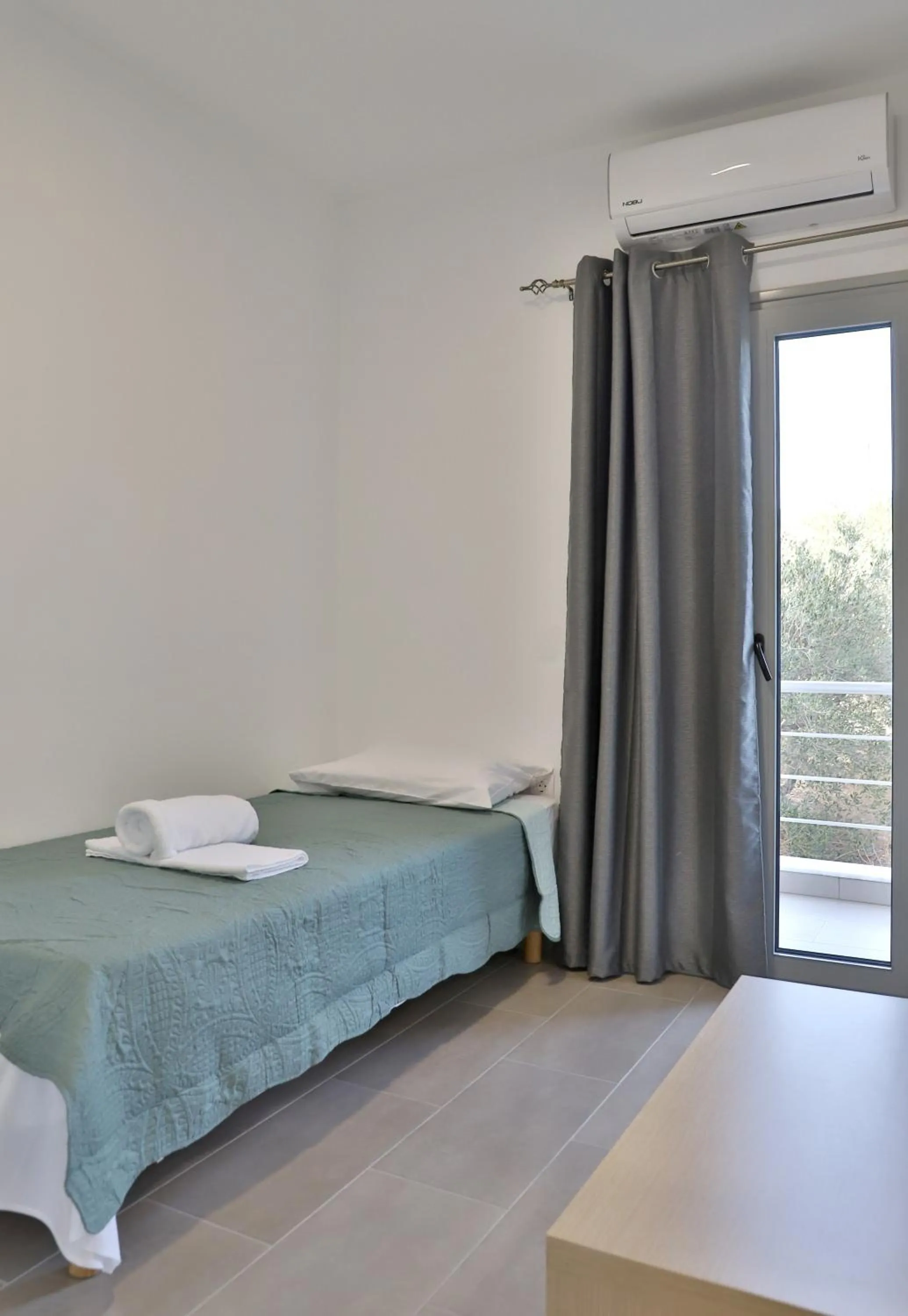 Bed in Helios Studios & Apartments