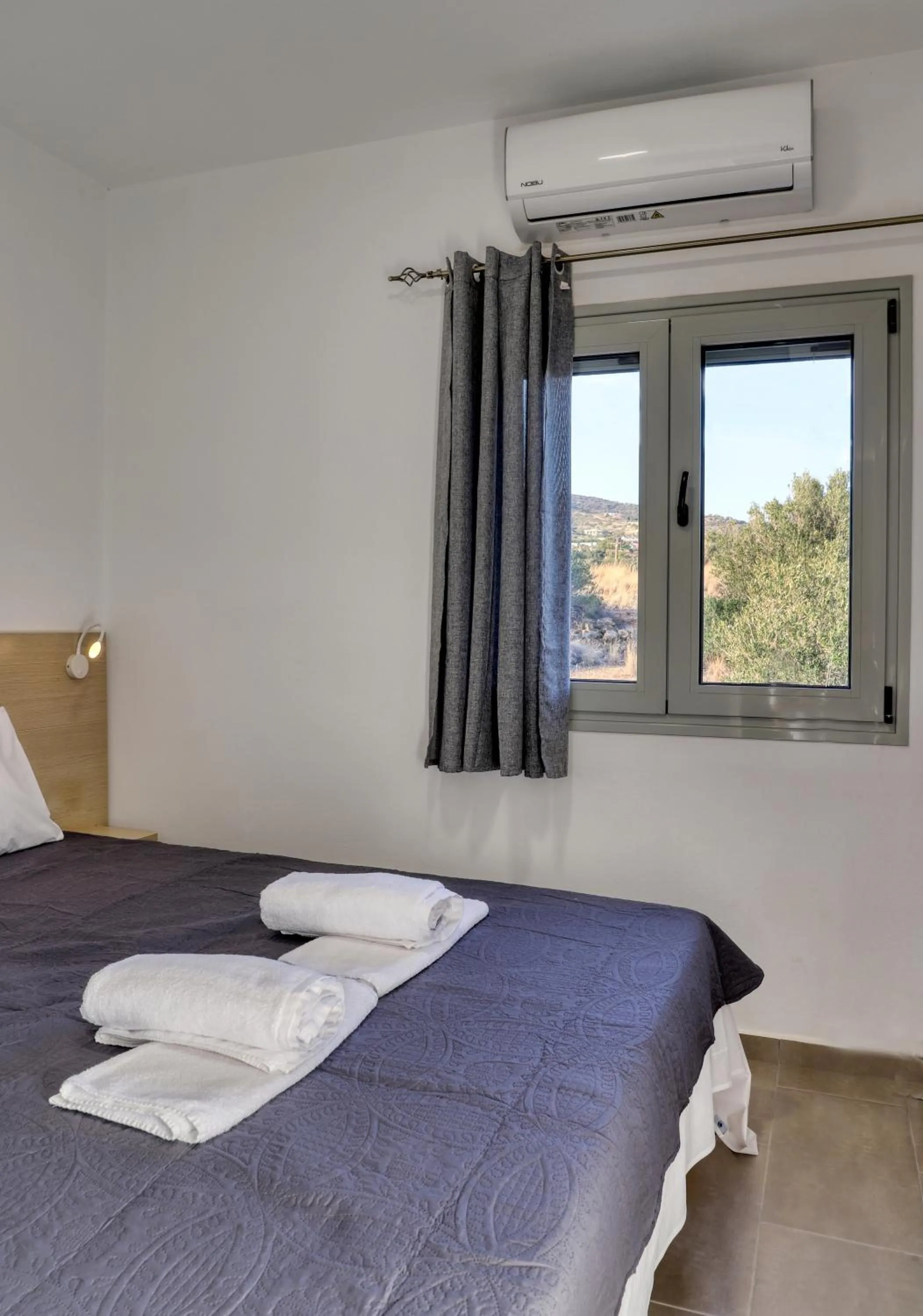 Bed in Helios Studios & Apartments