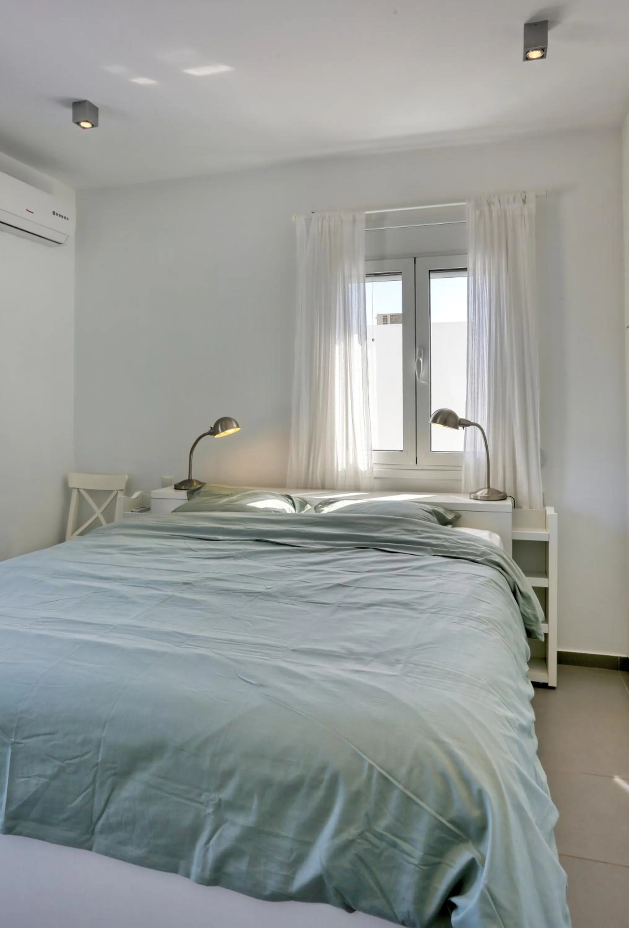 Bed in Helios Studios & Apartments