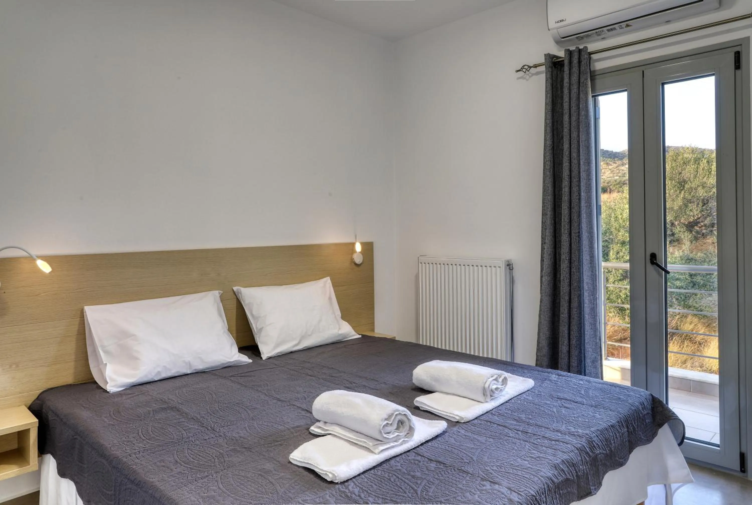 Bed in Helios Studios & Apartments