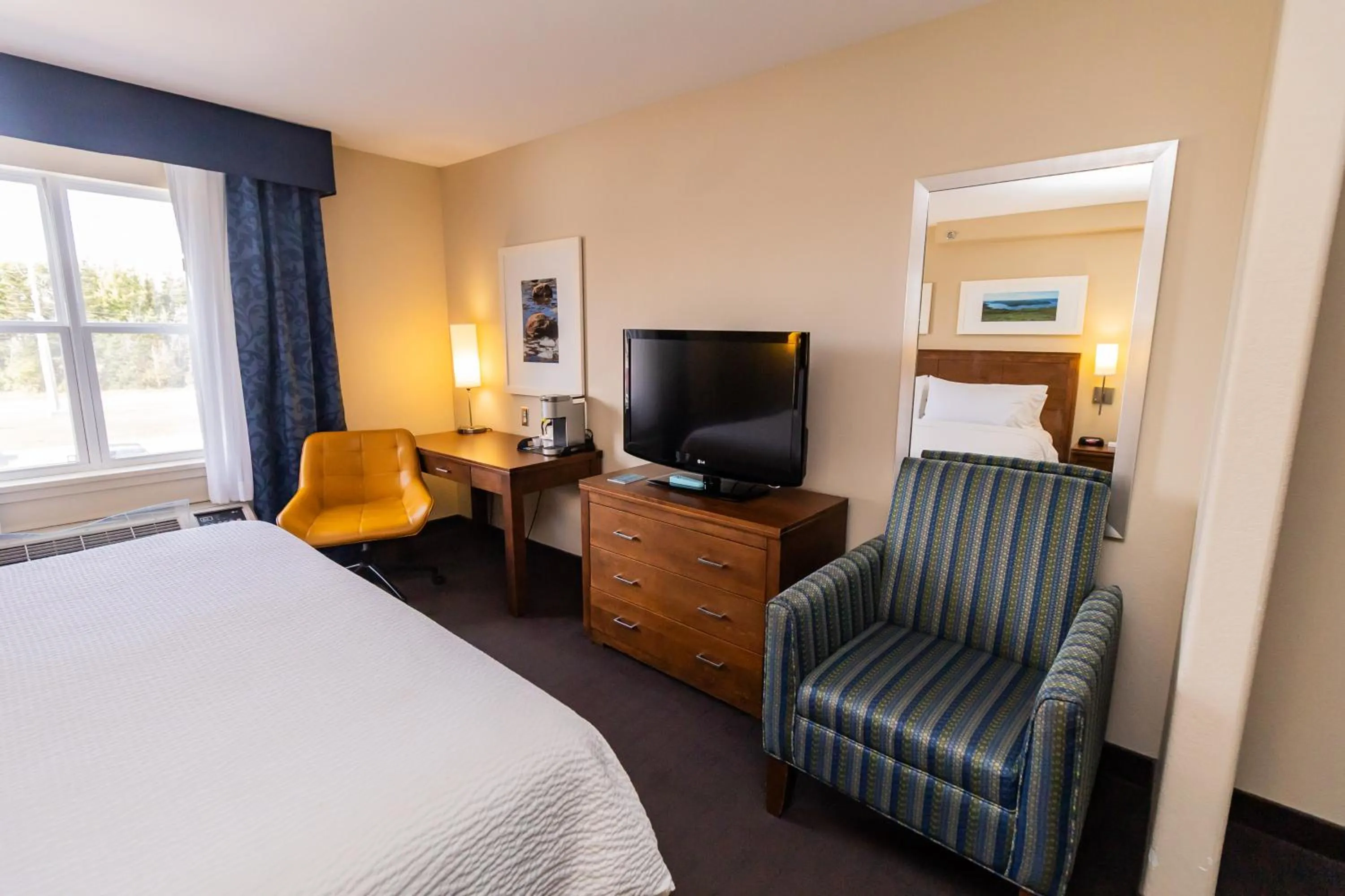 Seating area, Bed in Deer Lake Horizon Hotel, BW Signature Collection