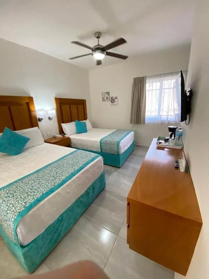 Photo of the whole room, Bed in Hotel Posada Quinta Las Flores