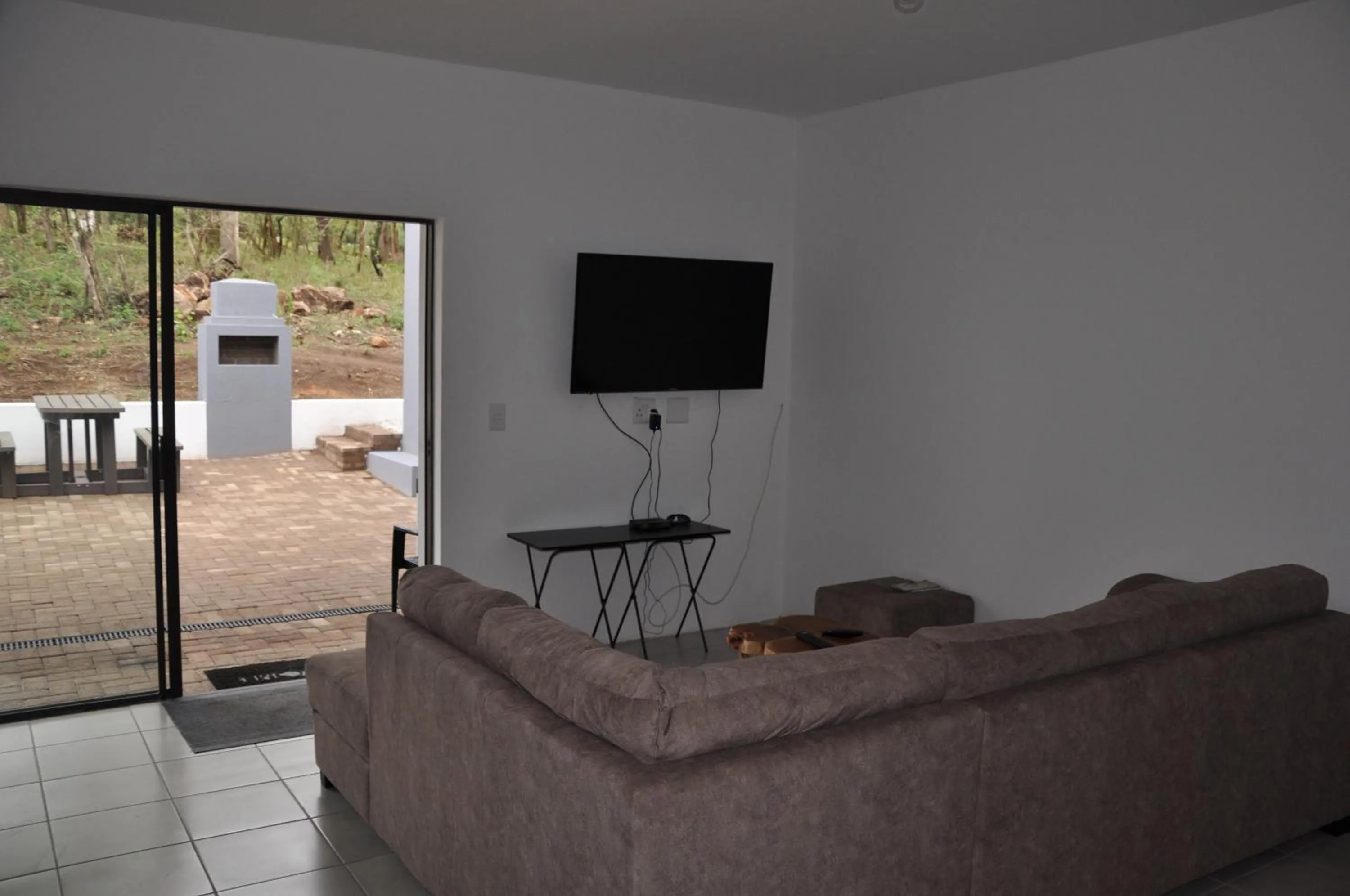 Communal lounge/ TV room in Hazyview Buffalo Game Lodge