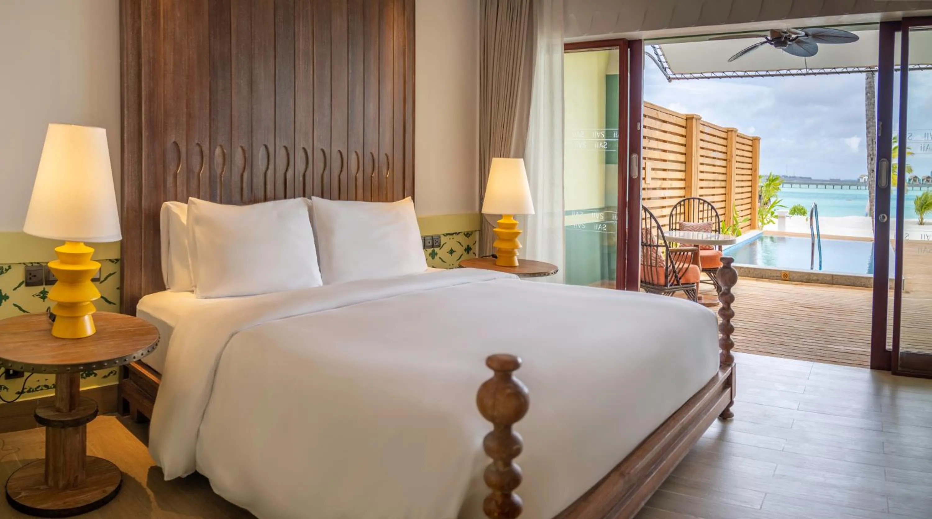 Photo of the whole room, Bed in SAii Lagoon Maldives, Curio Collection By Hilton