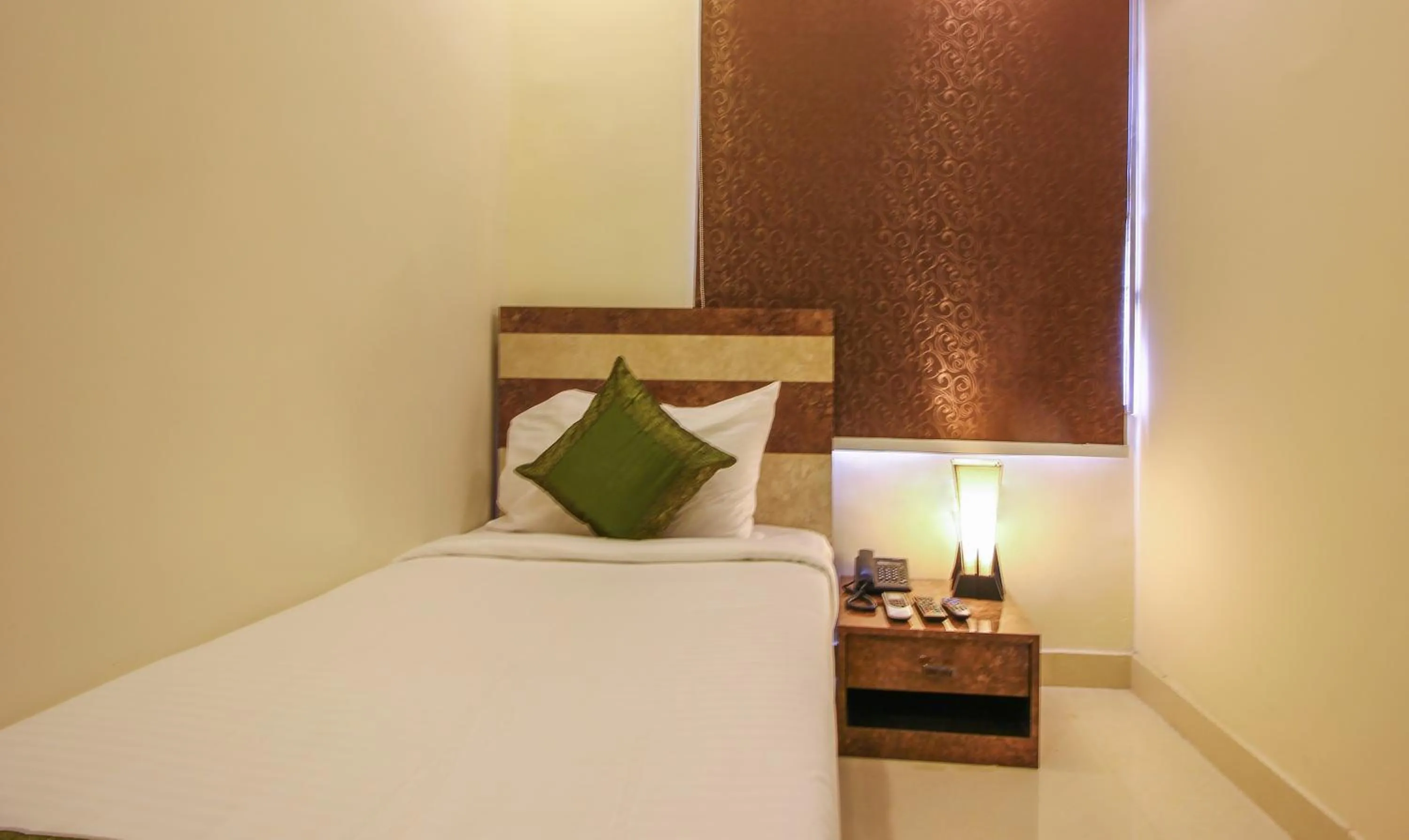 Bedroom, Bed in Treebo Address Inn, Banjara Hills