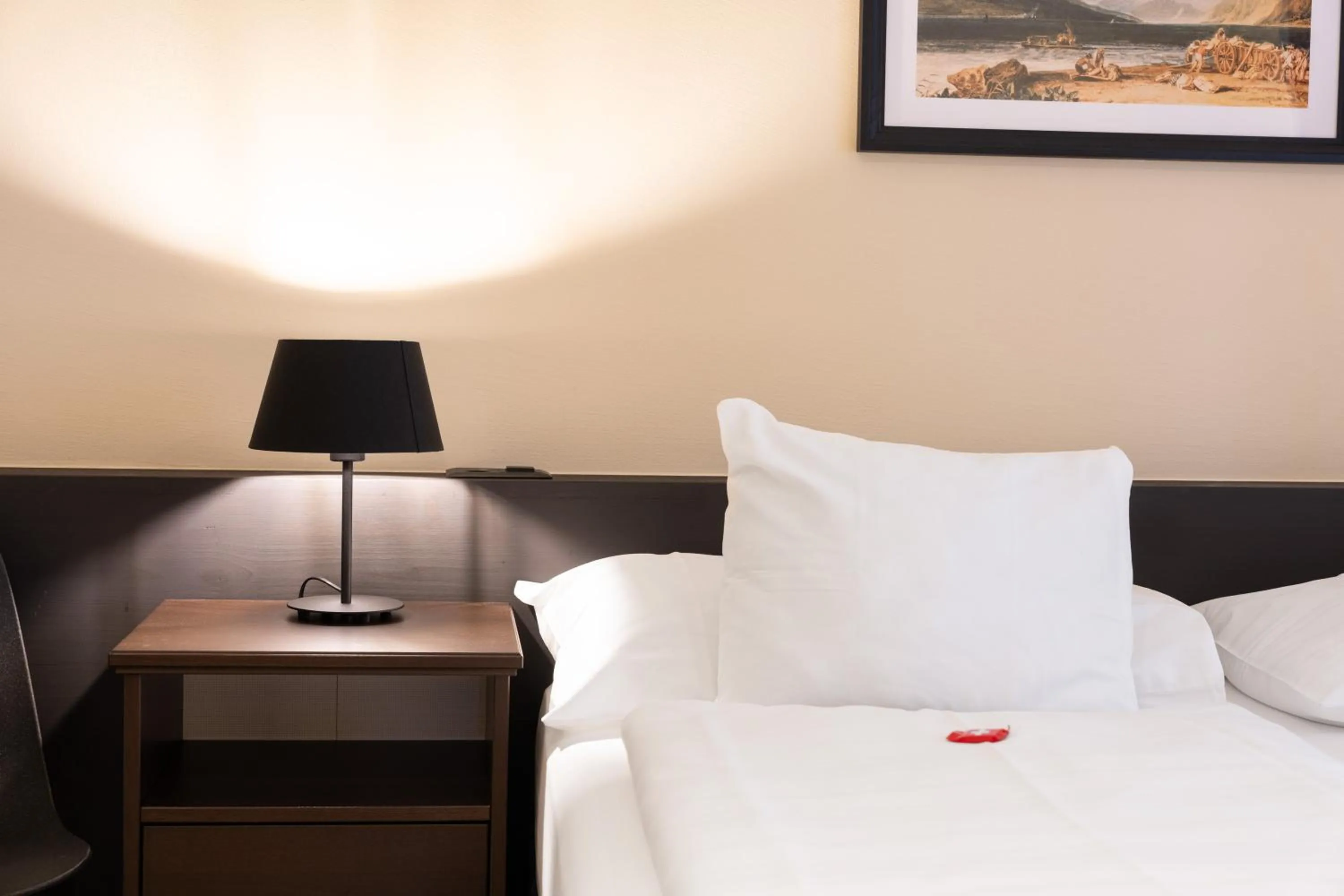 Bed in Swiss Inn & Apartments