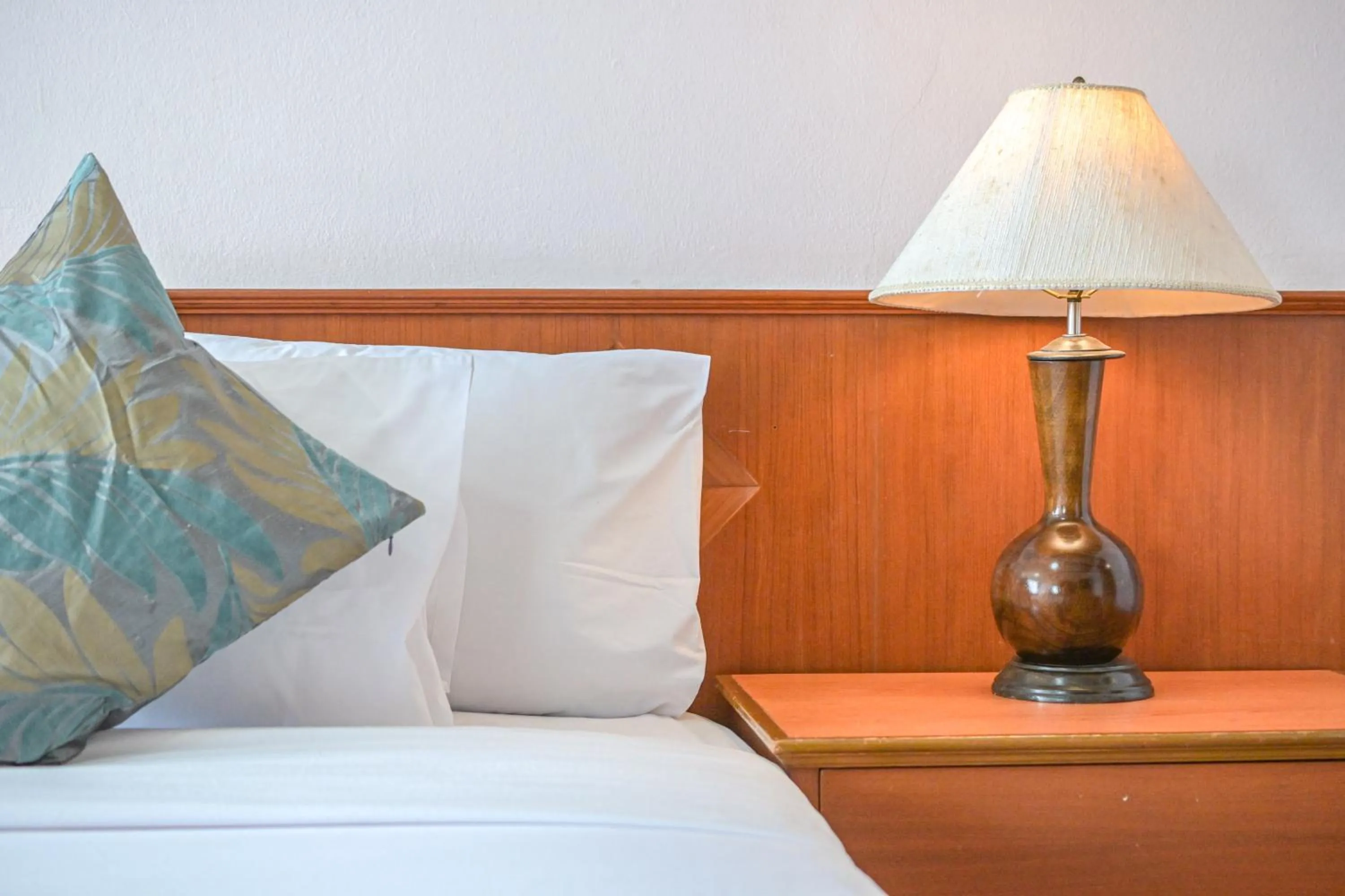 Bed in Rattana Park Hotel