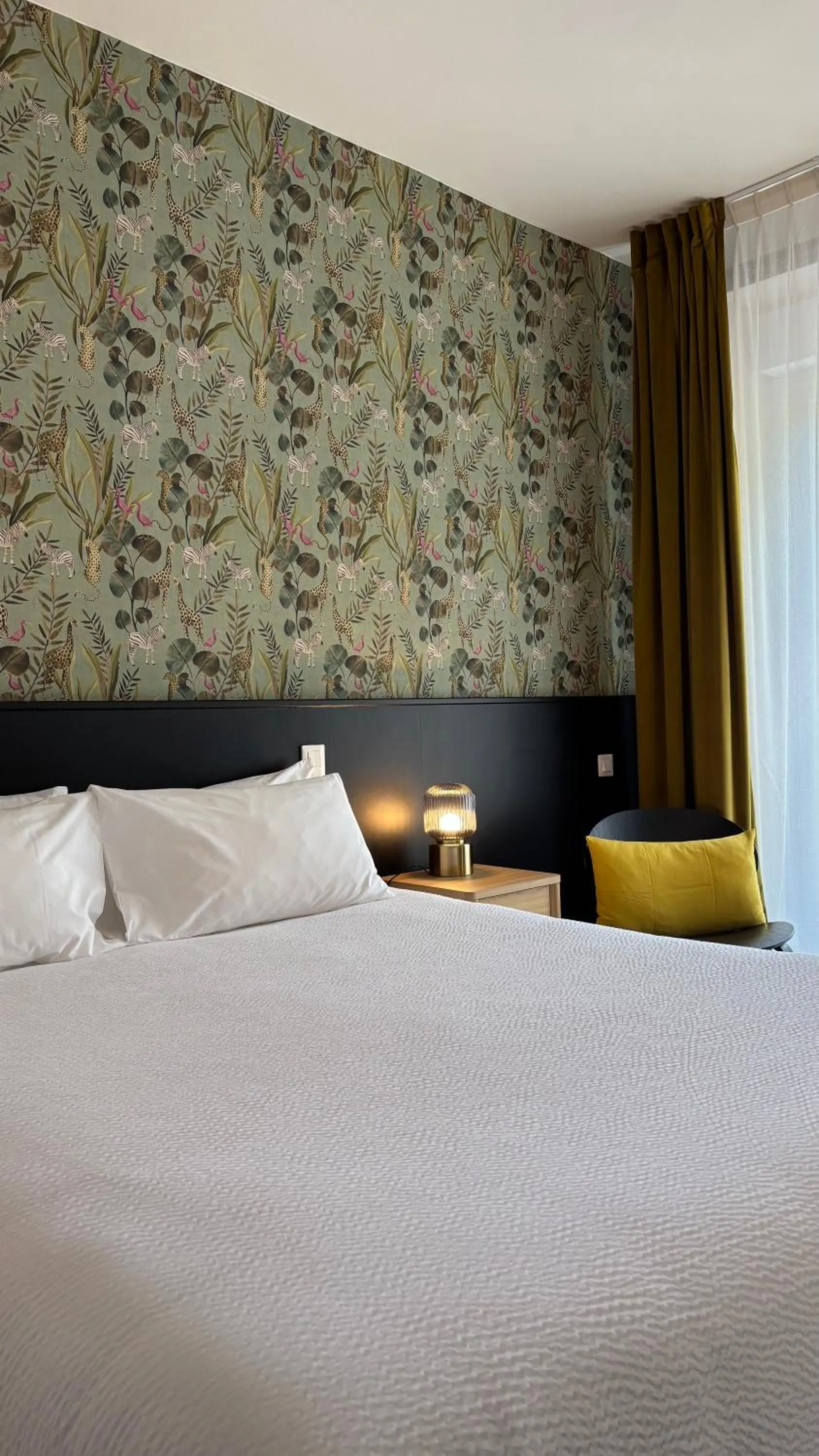 Photo of the whole room, Bed in Logis Hôtel Restaurant Grand Hôtel de Lyon