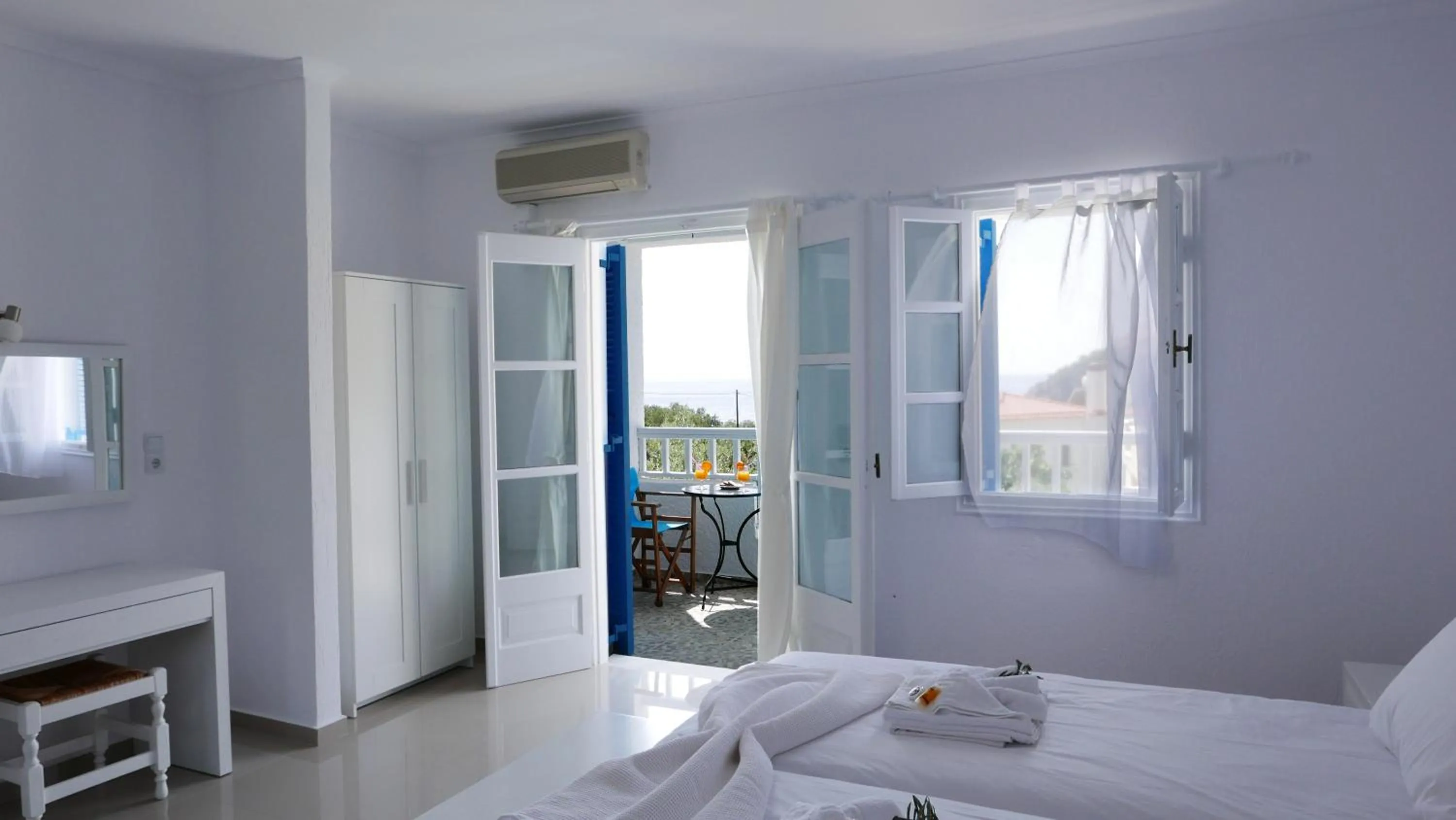 Bed in Limnionas Bay Village Hotel