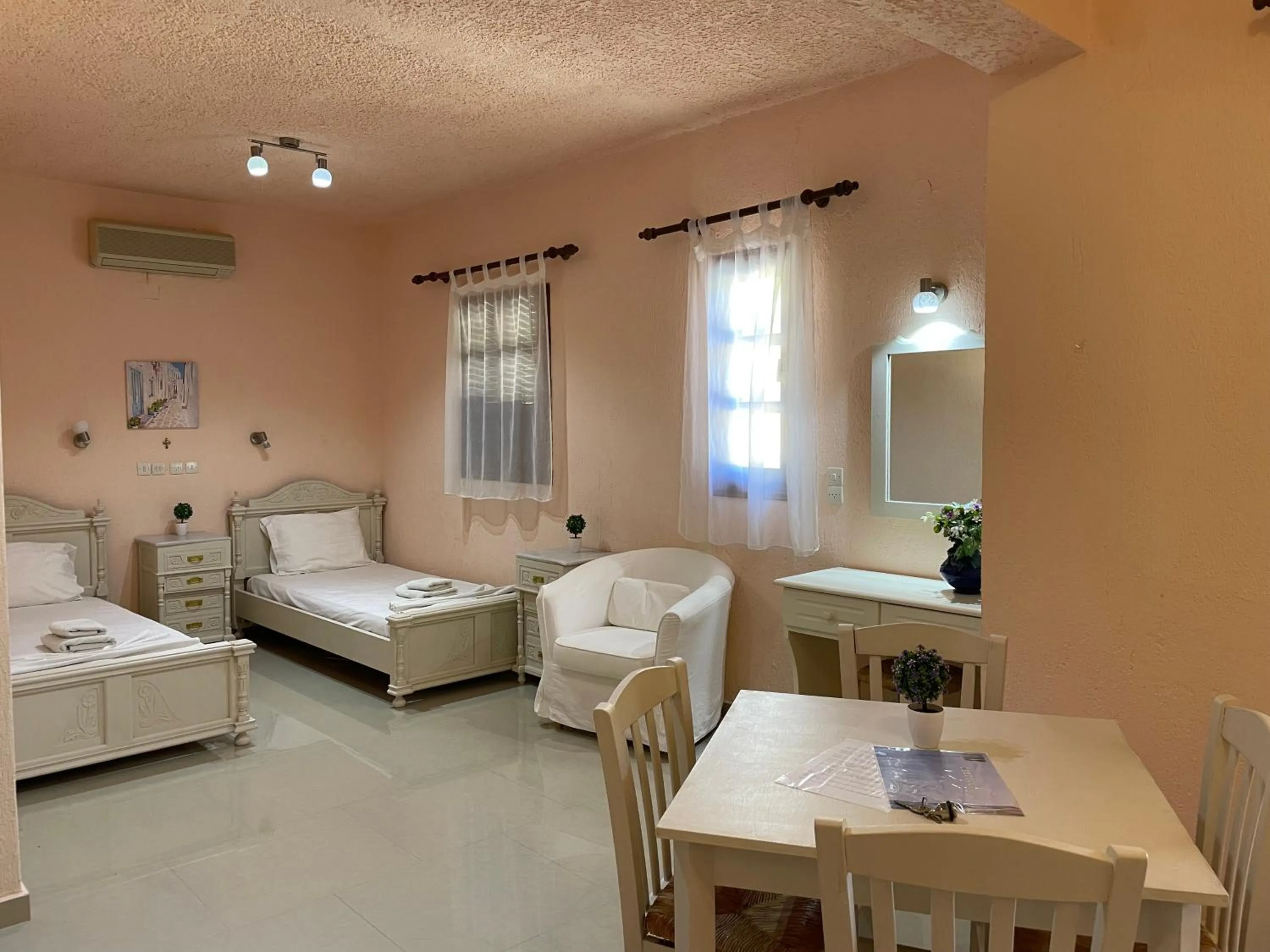 Bed in Limnionas Bay Village Hotel