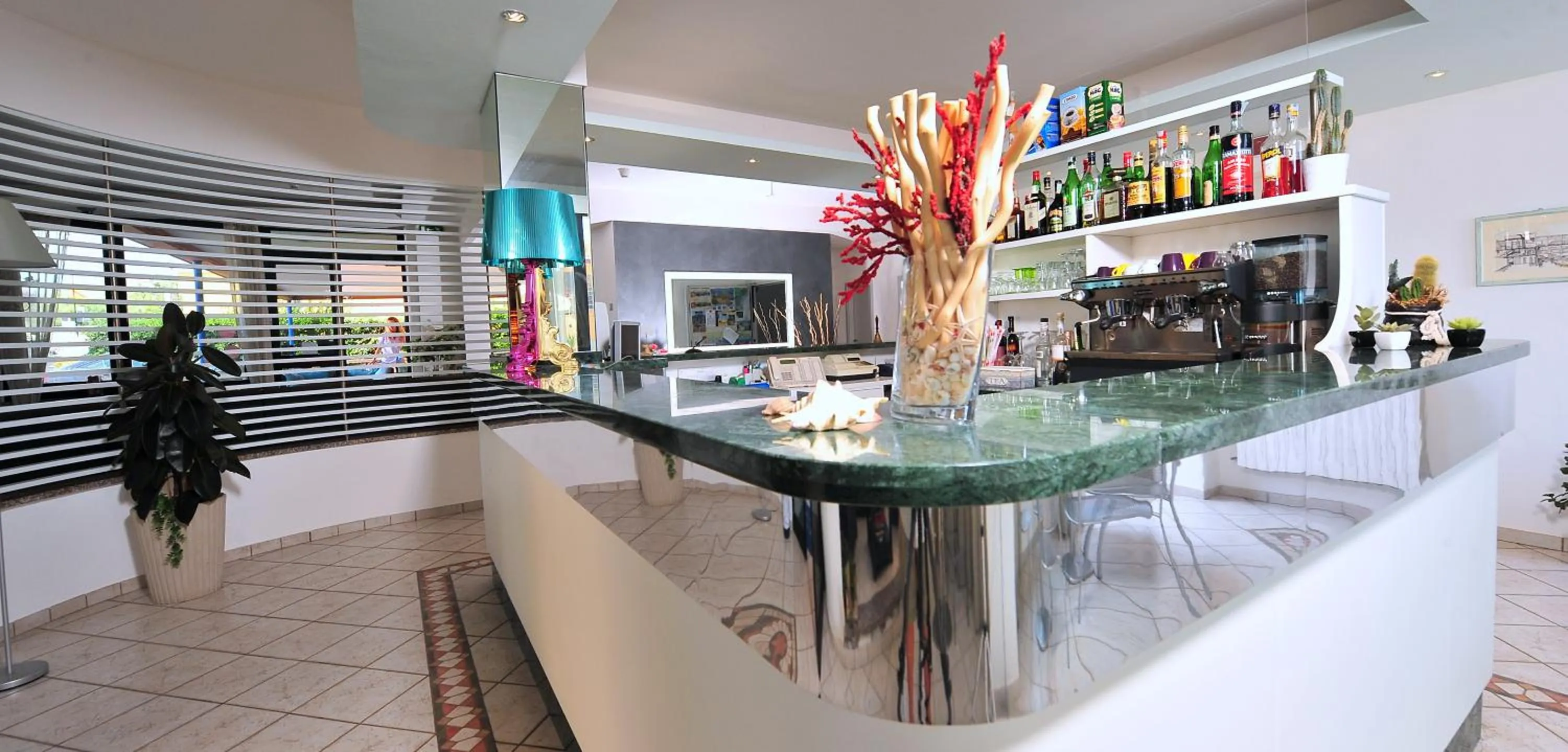 Communal lounge/ TV room in Hotel il Delfino