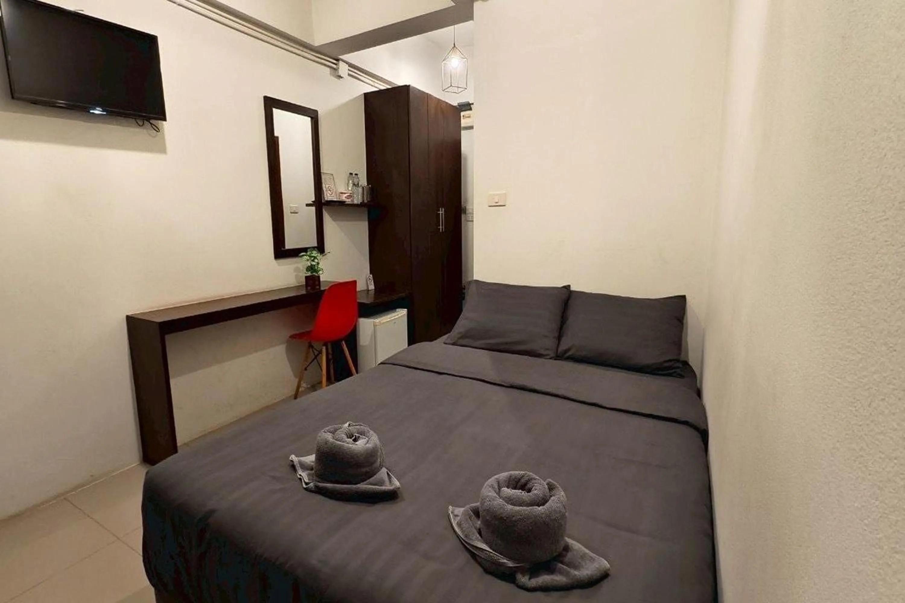 Bed in Hotel Wualai by CMStay