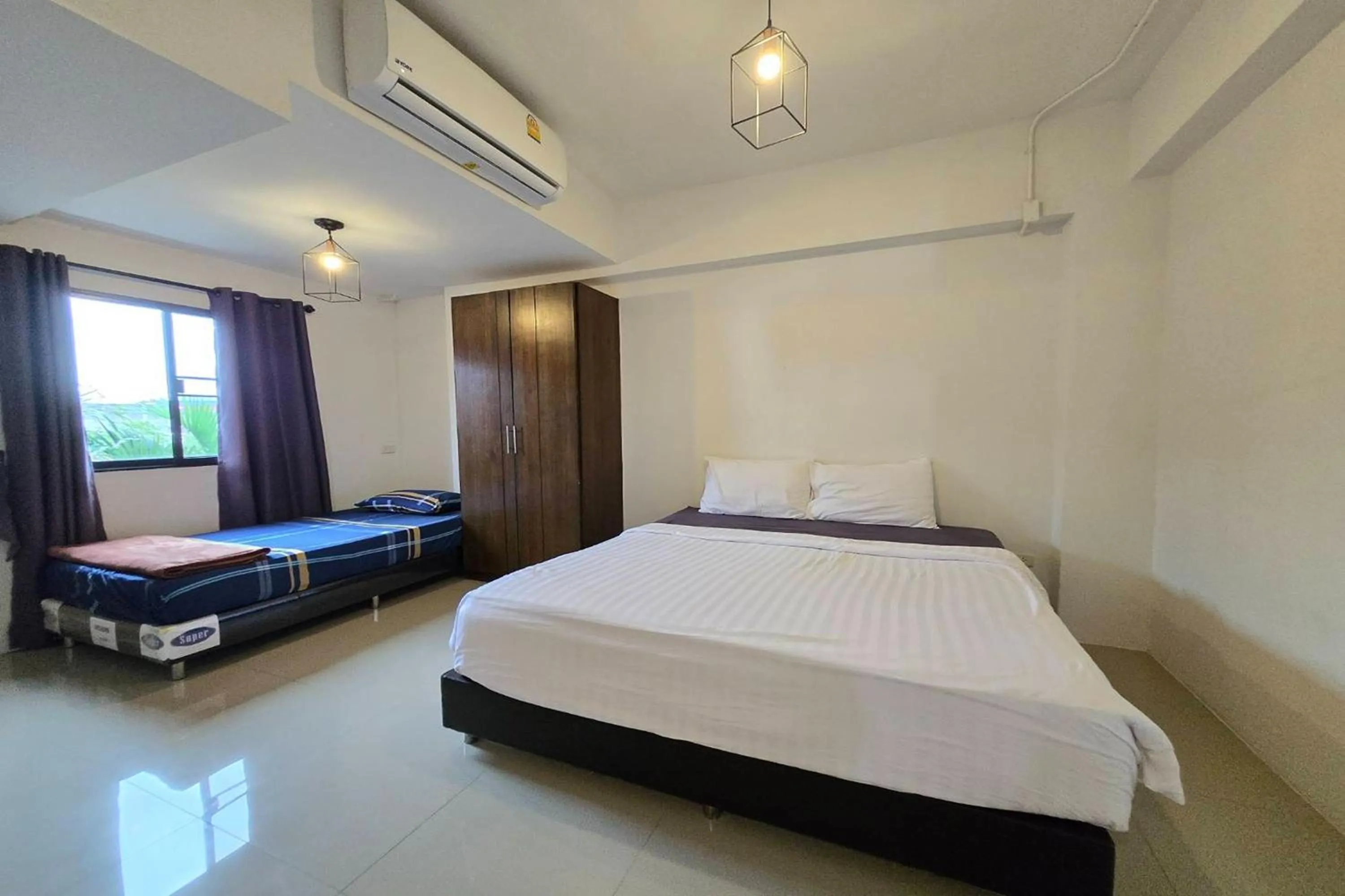 Bed in Hotel Wualai by CMStay