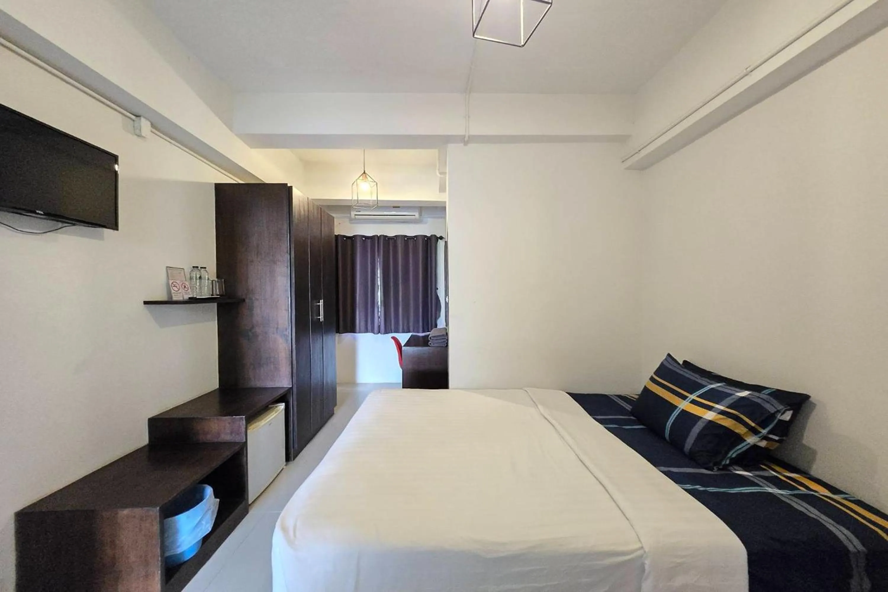 Bed in Hotel Wualai by CMStay