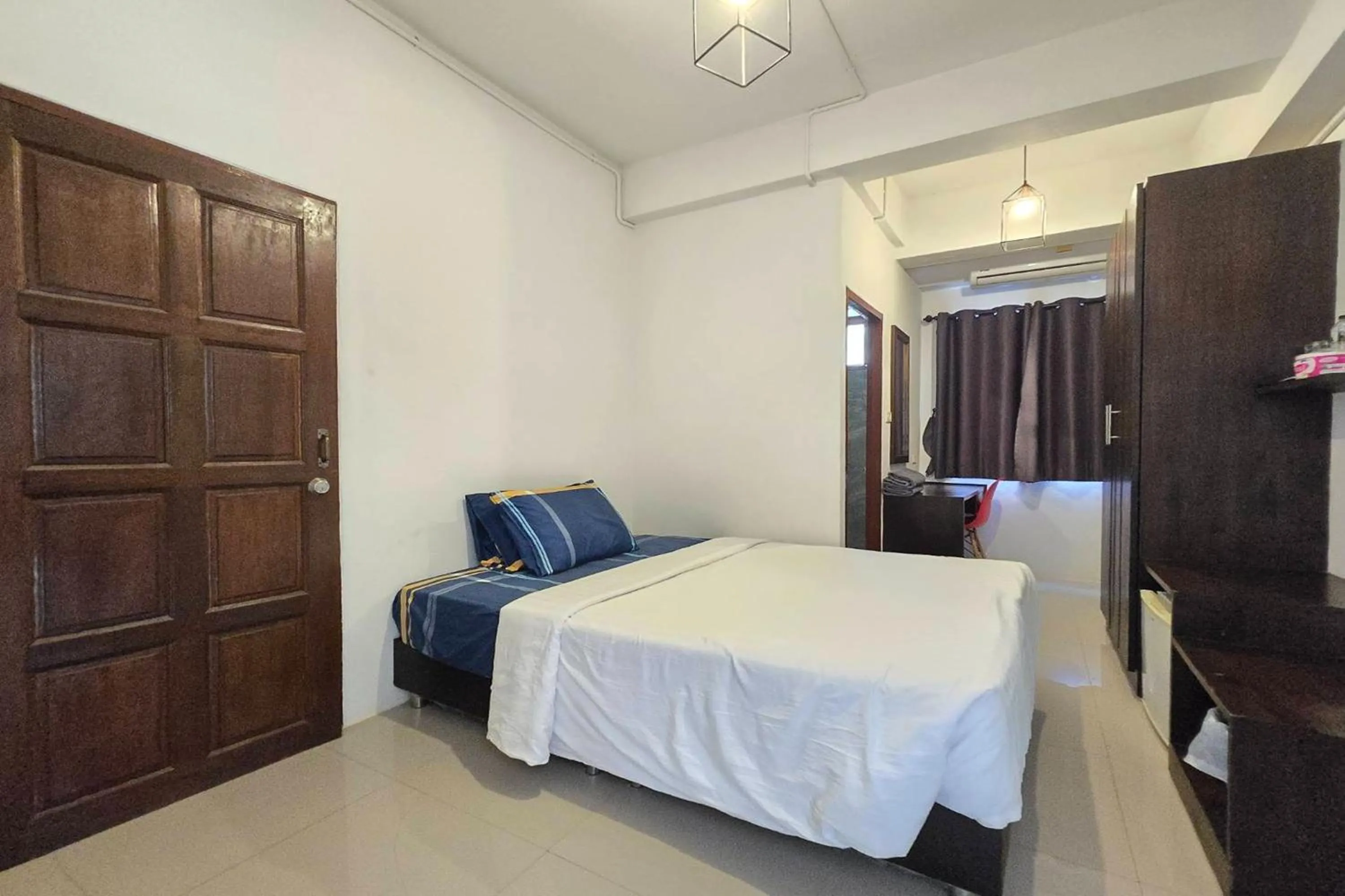 Bed in Hotel Wualai by CMStay