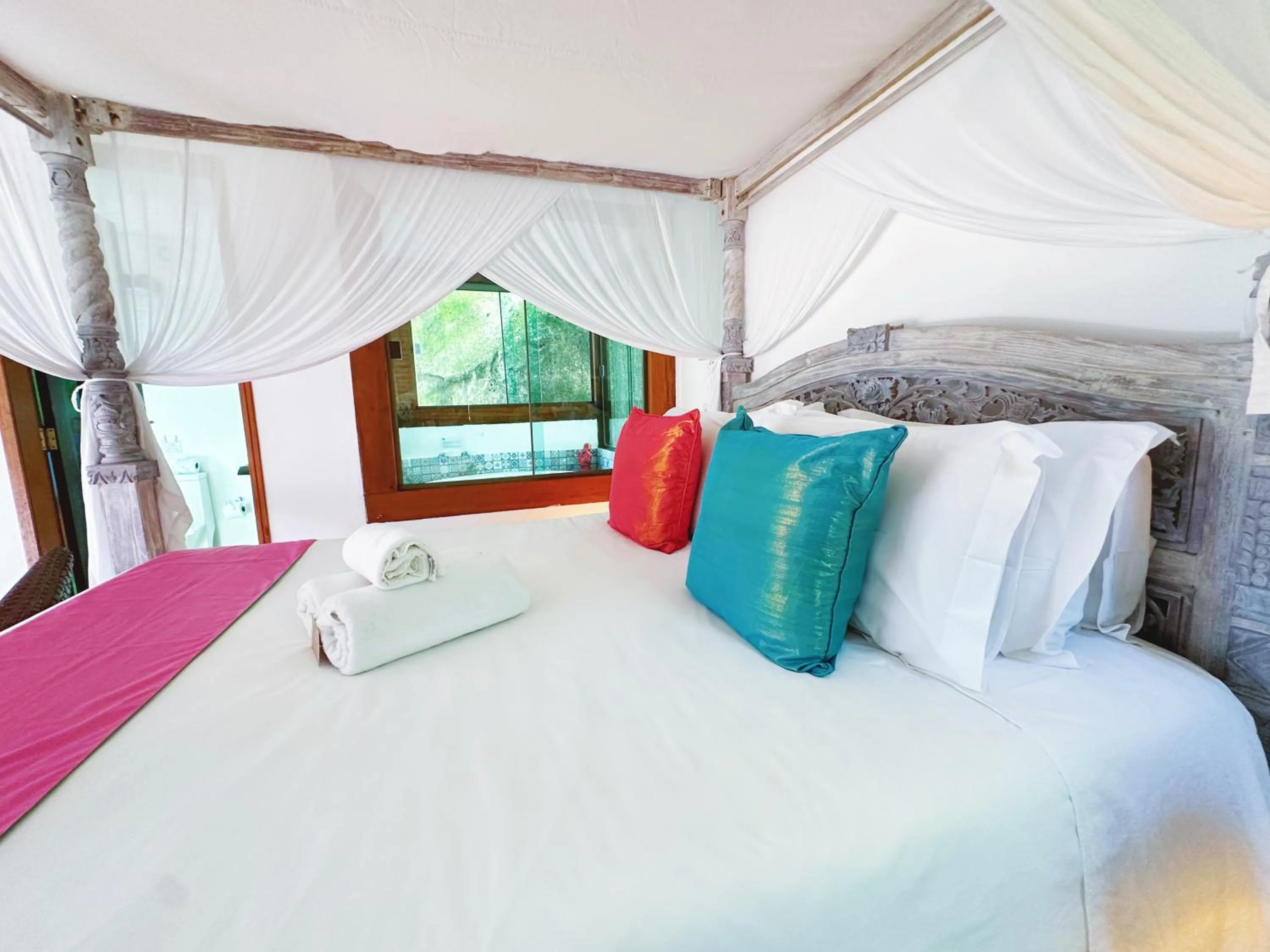 Bed in Hotel Vila Kebaya