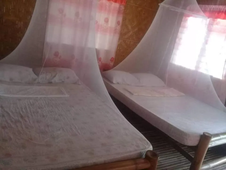 Bed in Junior & Nemesia's Cottages