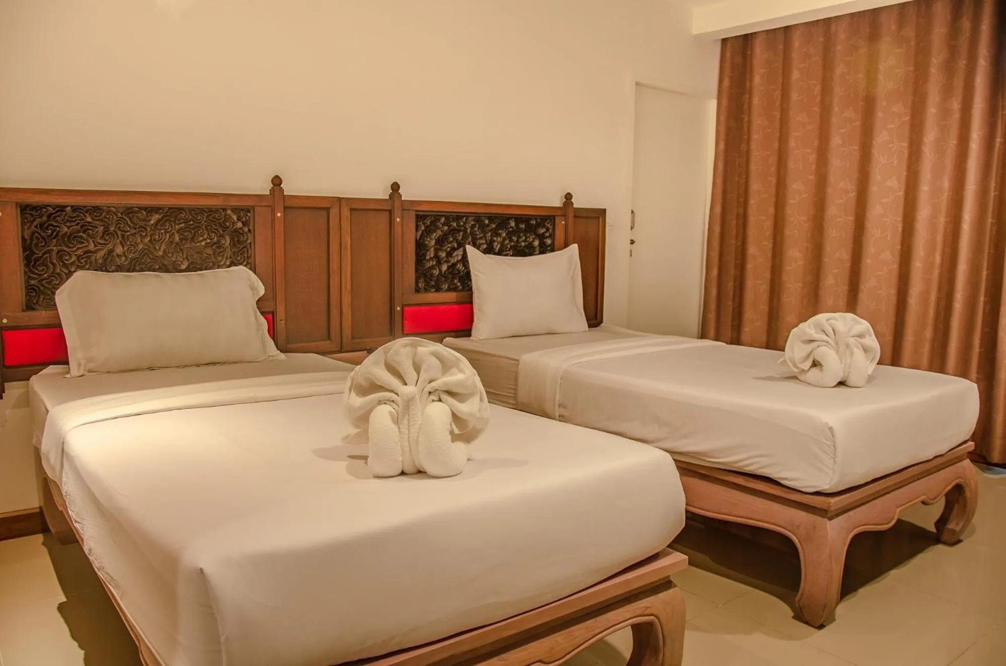 Bed in At Ruam Chok Hotel