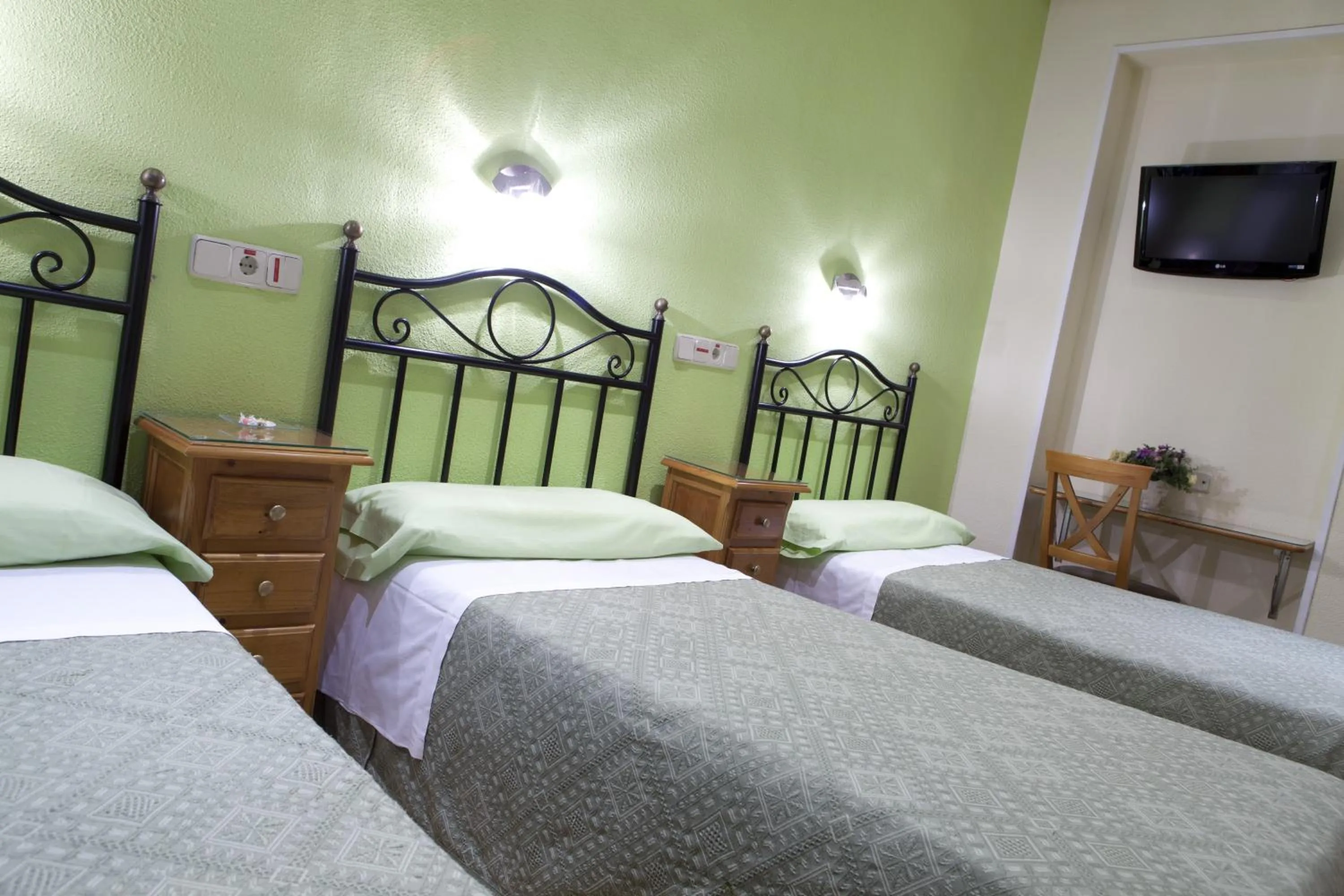 Bed in Hostal Los Alpes