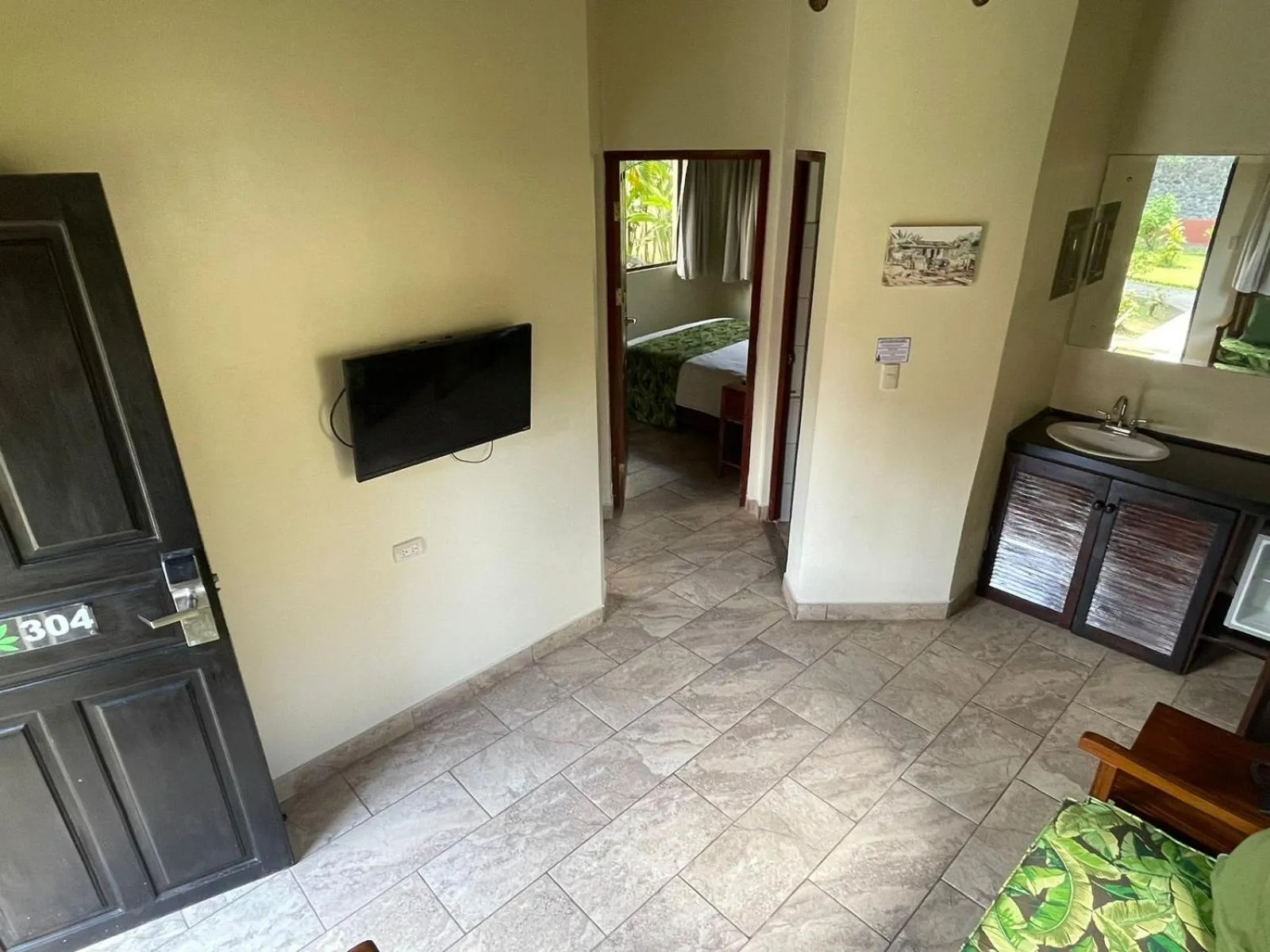 Communal lounge/ TV room, Bed in La Foresta Nature Resort