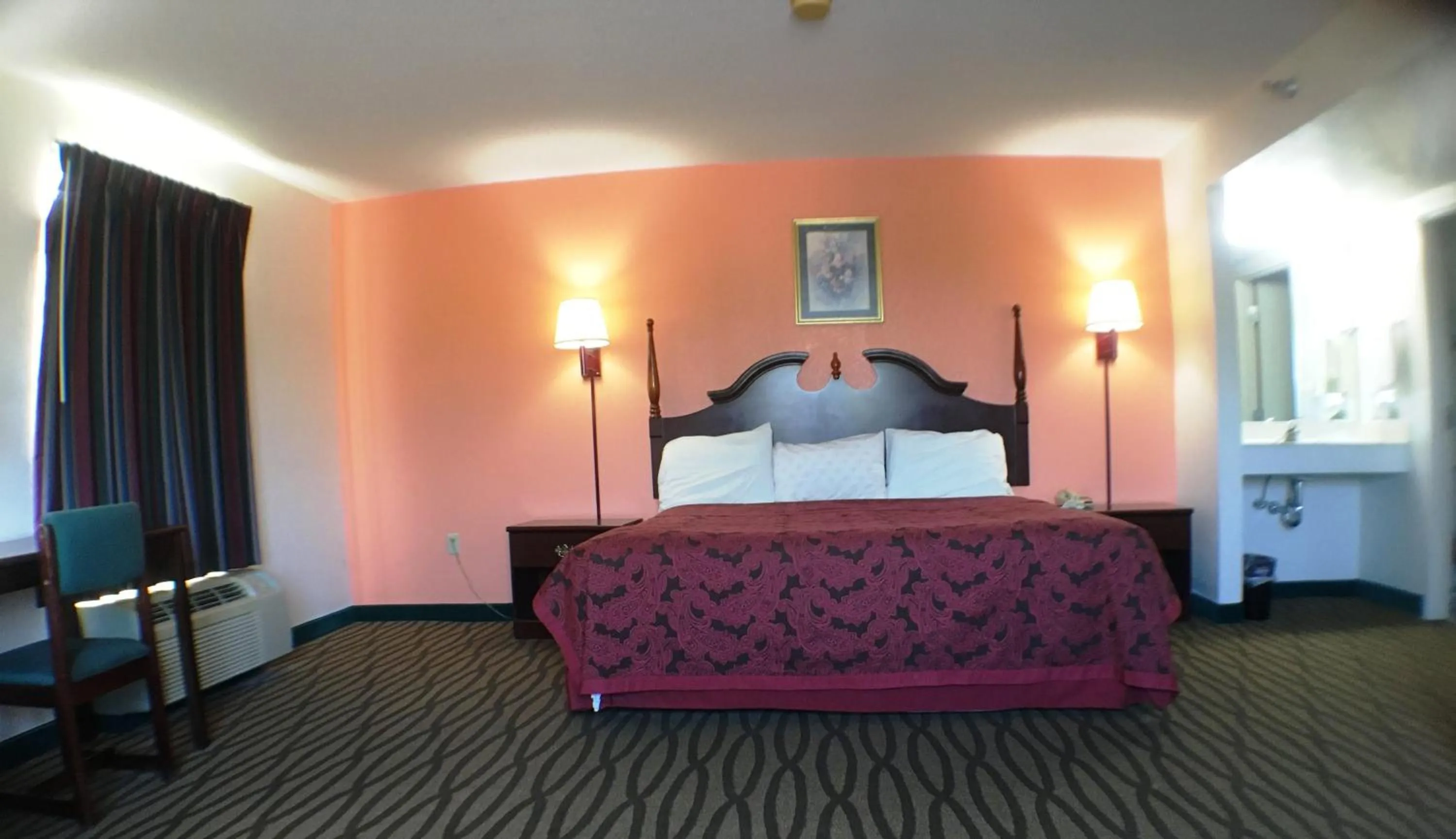 Bed in President Inn & Suites