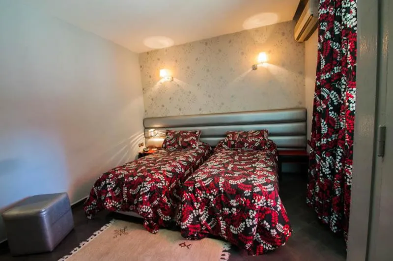 Bed in Hotel De La Paix