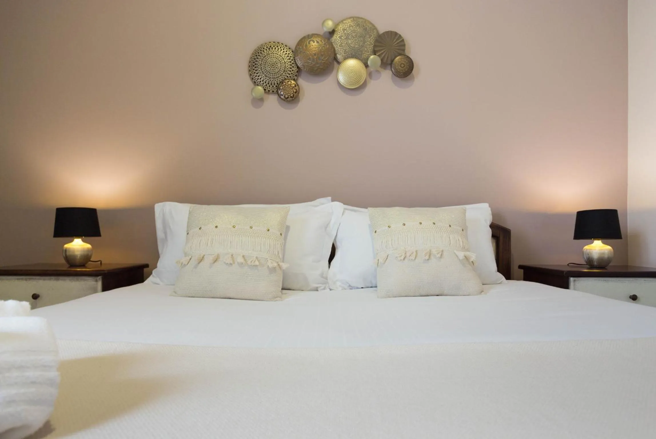 Bed in Arcobaleno Rooms
