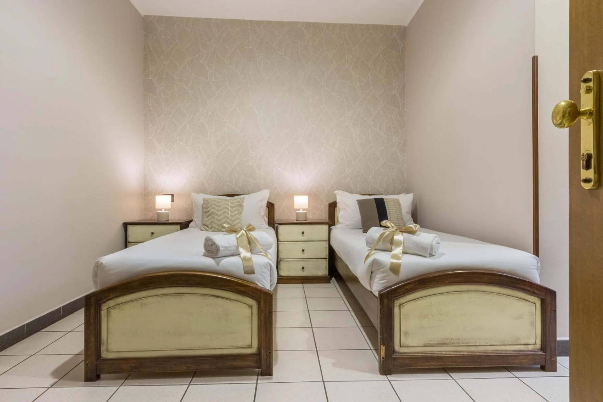 Bed in Arcobaleno Rooms