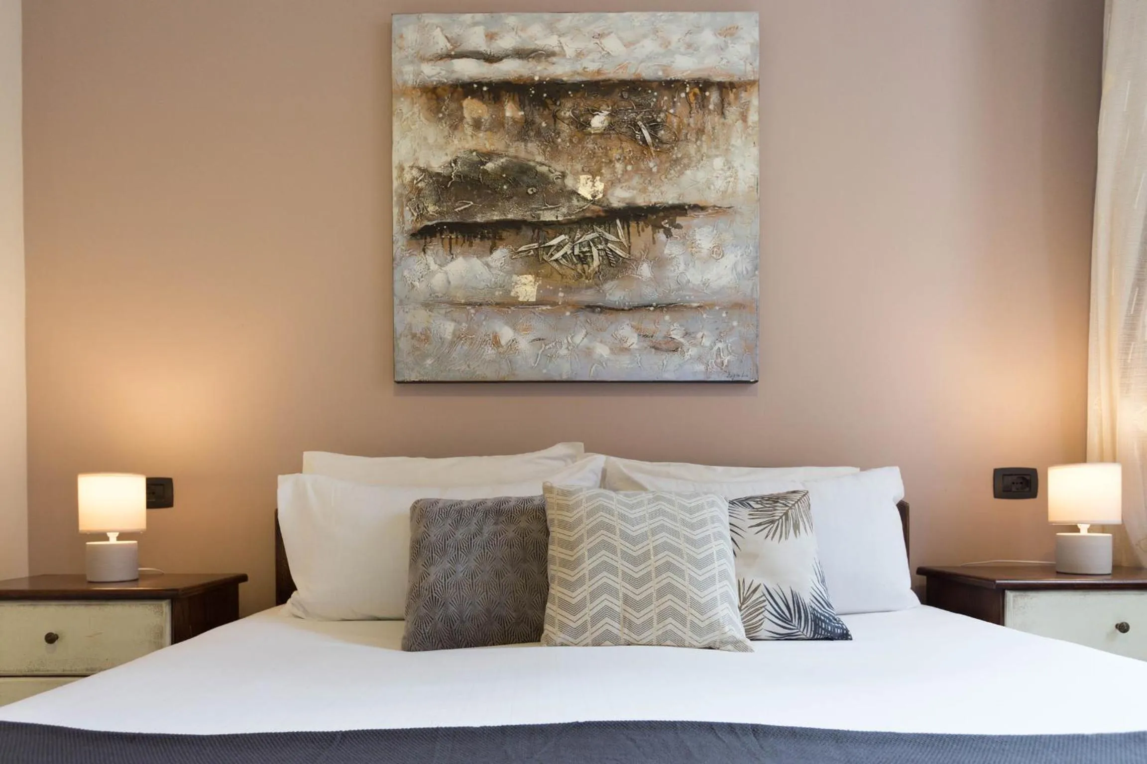 Bed in Arcobaleno Rooms