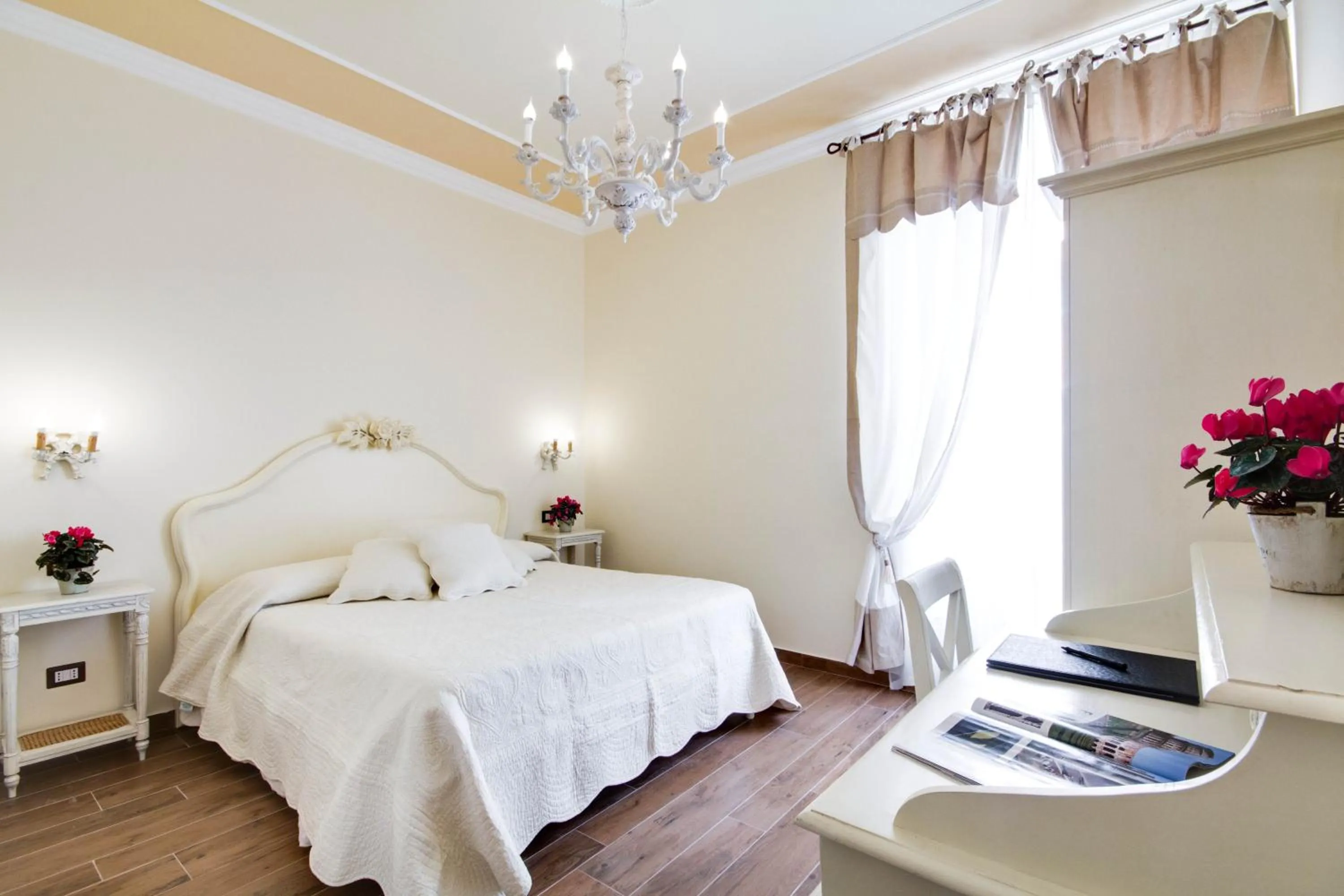 Bed in Lunaria Suites Rome Vaticano