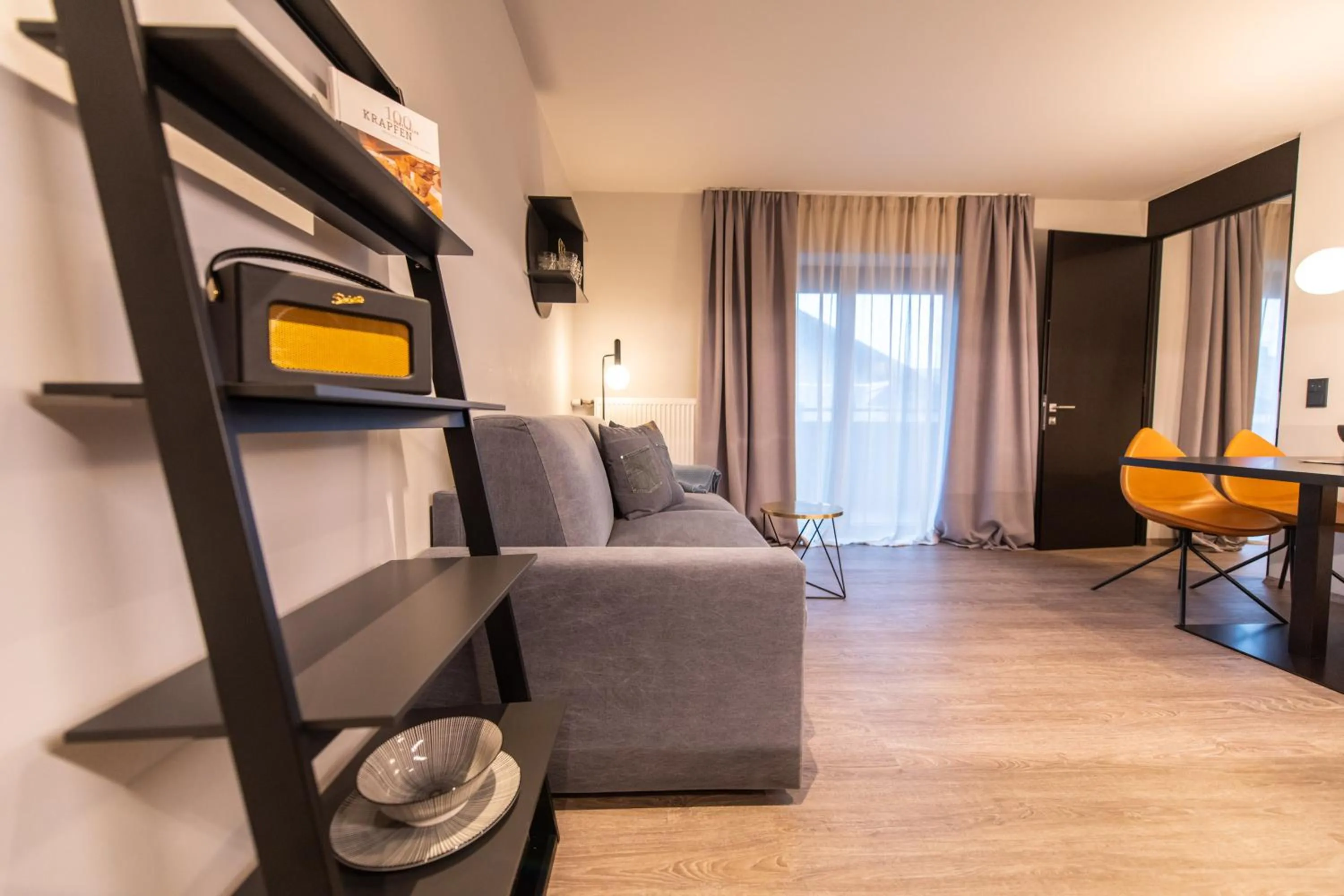 Living room, Bed in Burgus - Design Suites & Apartments