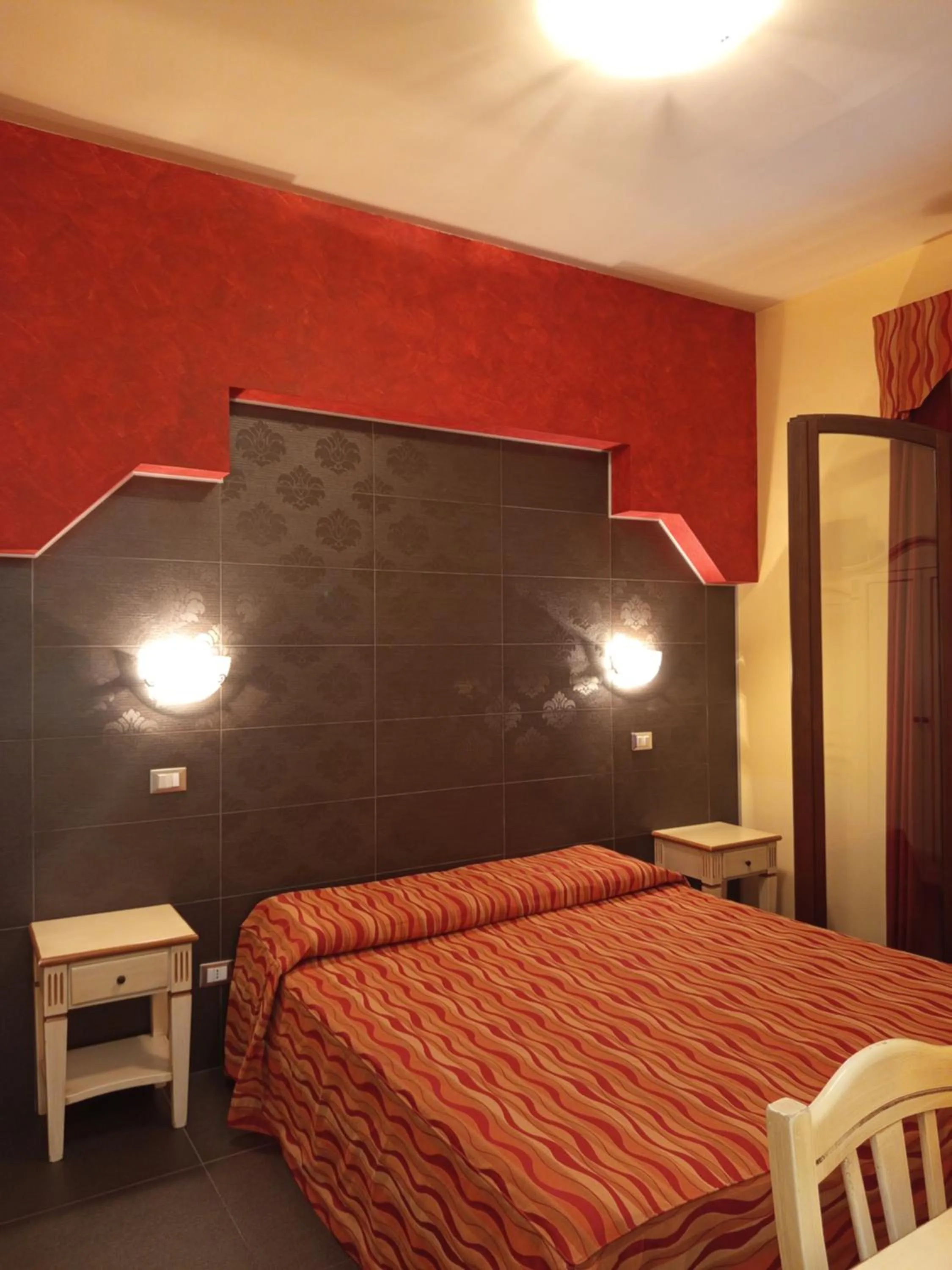 Bedroom in Amaryllis Hotel