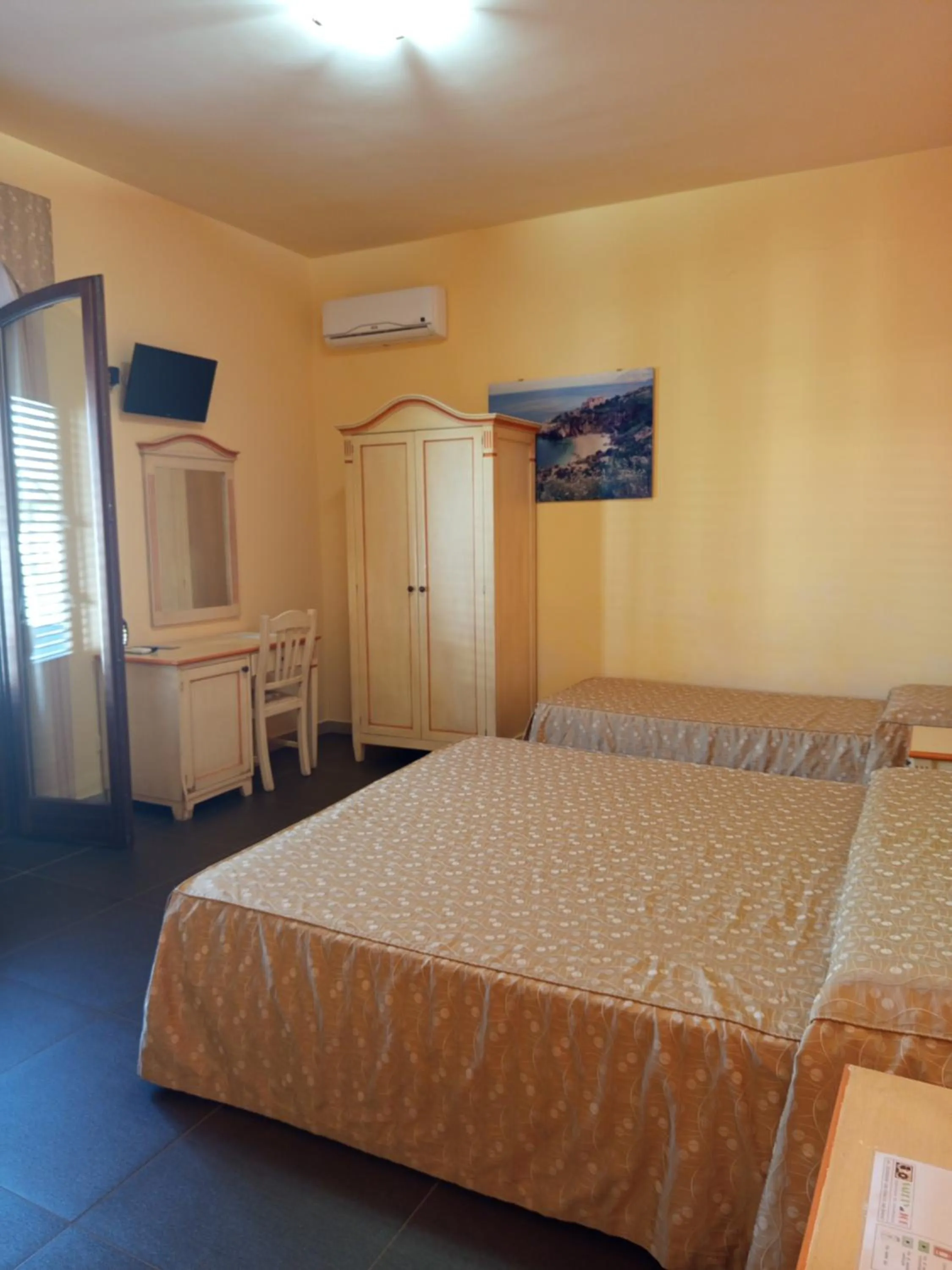 Bedroom in Amaryllis Hotel