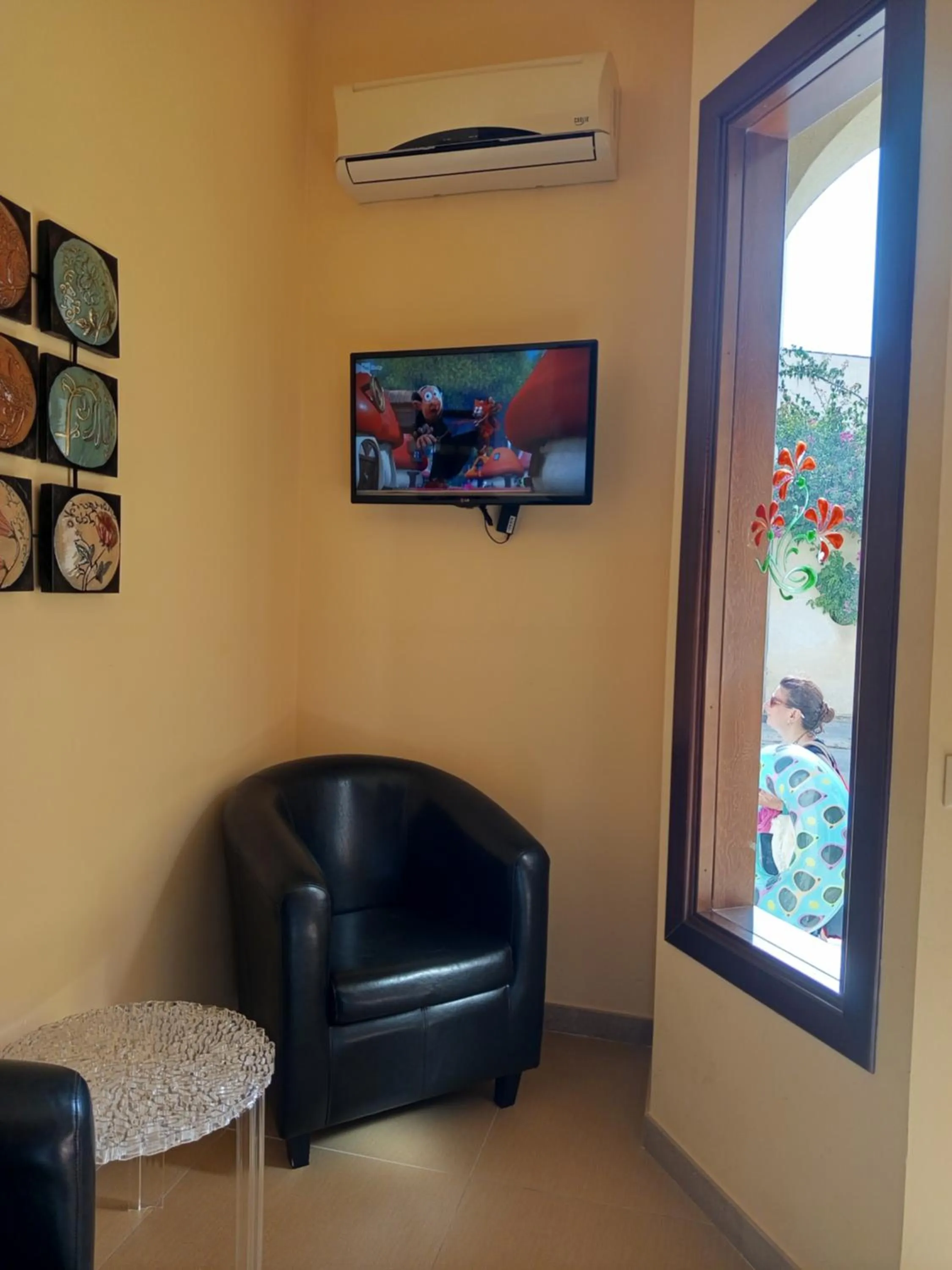 Communal lounge/ TV room in Amaryllis Hotel