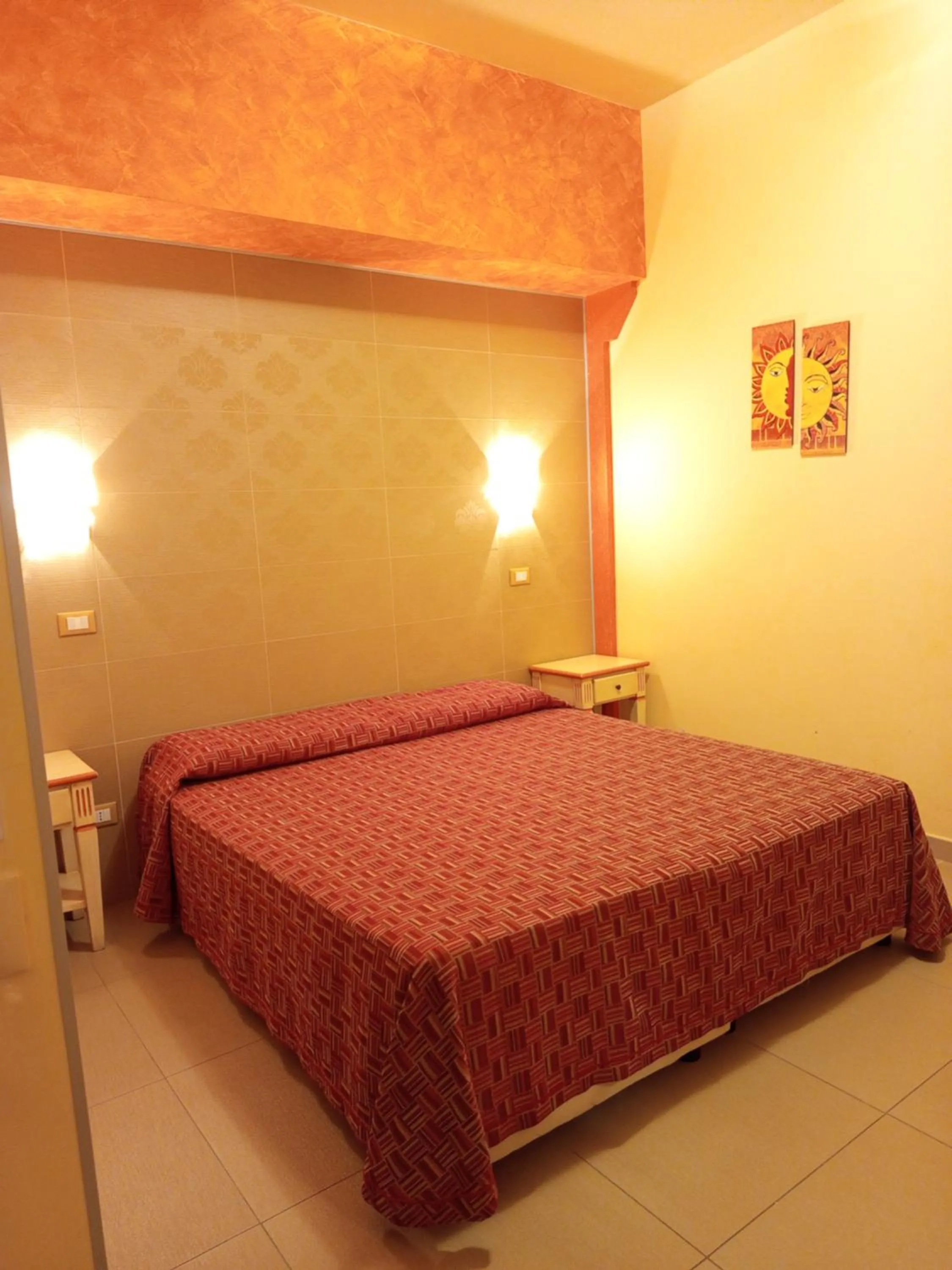 Bed in Amaryllis Hotel