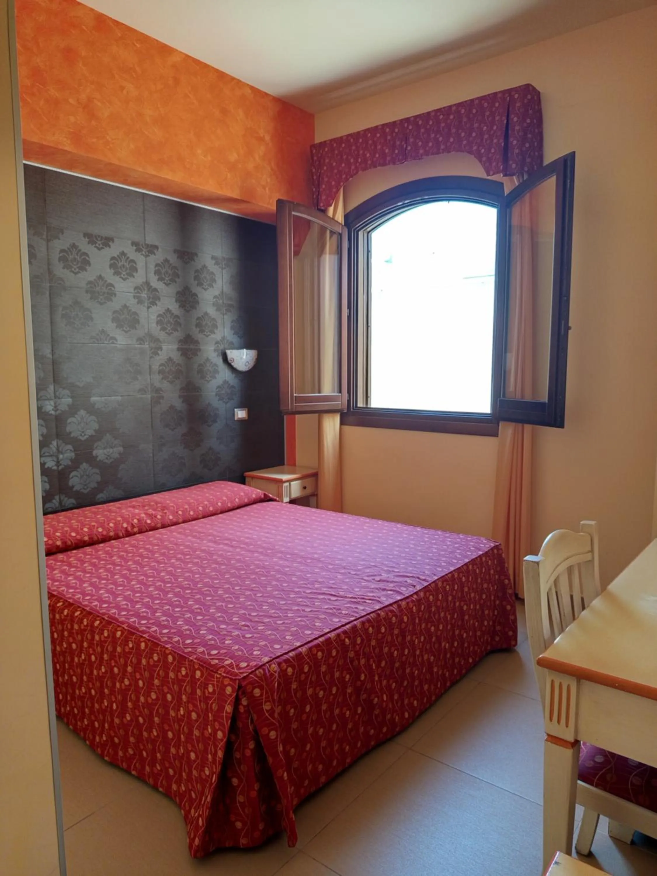 Bedroom in Amaryllis Hotel