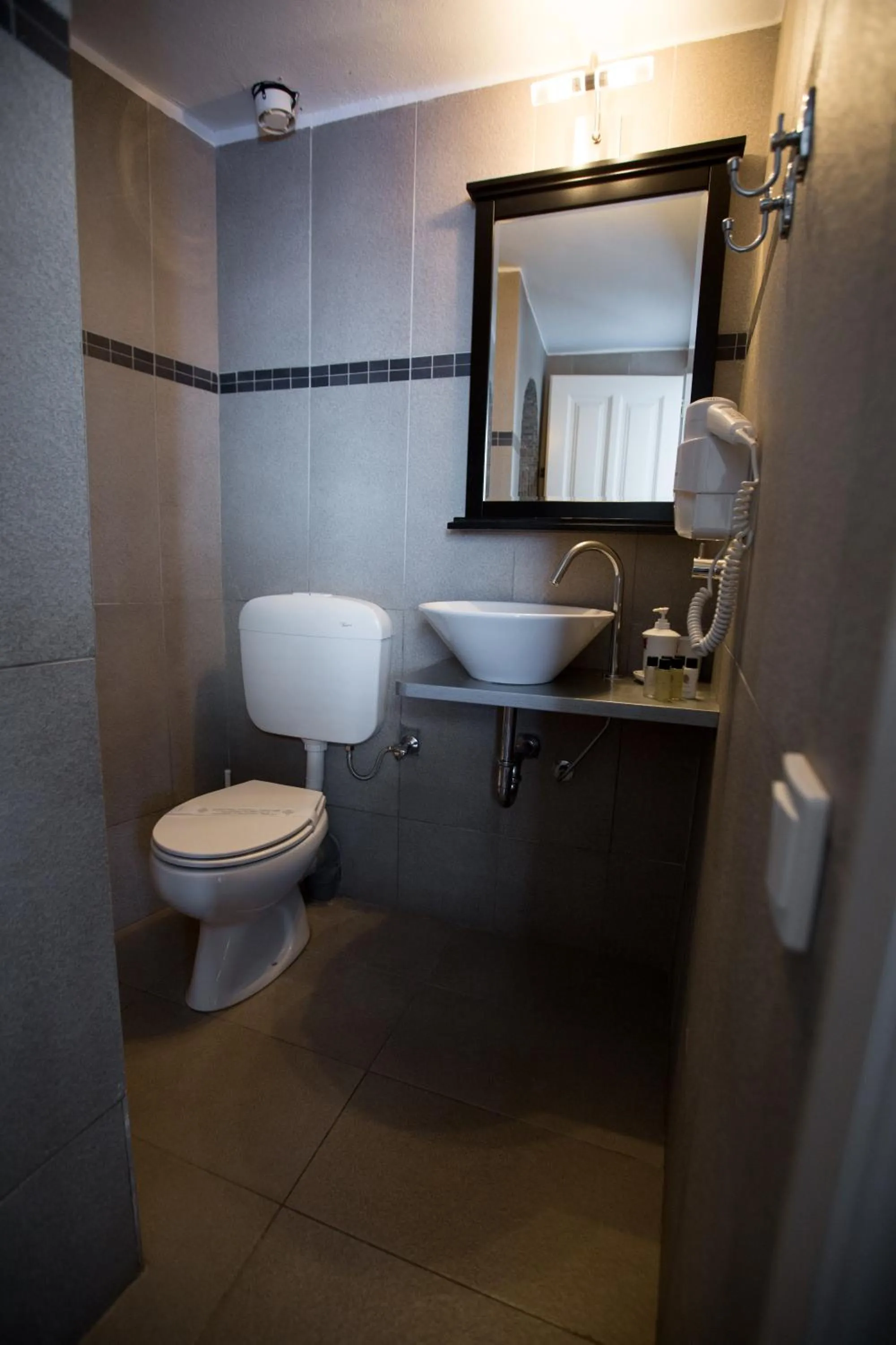 Toilet in Afroessa Hotel by Pearl Hotel Collection