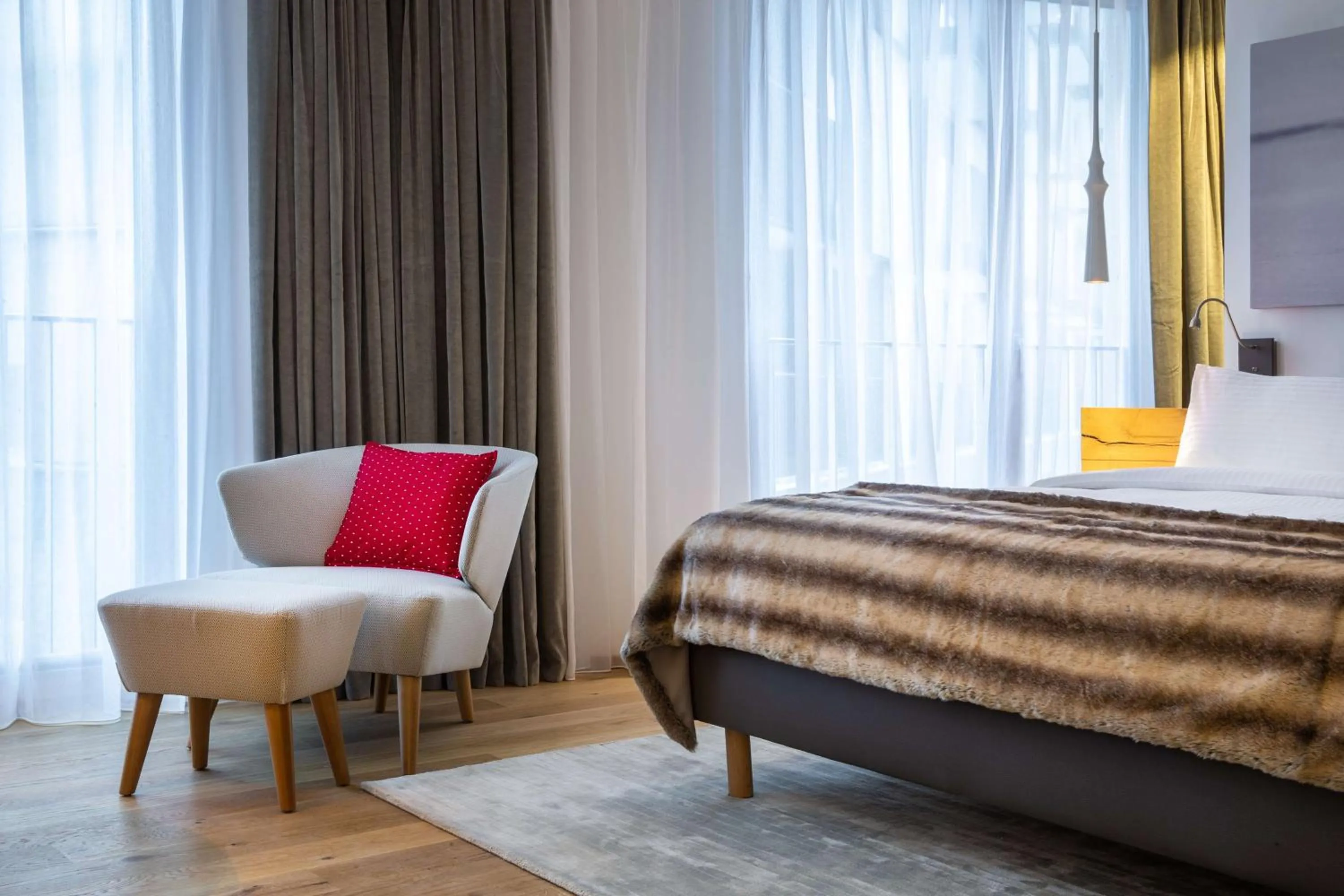 Photo of the whole room, Bed in Radisson Blu Hotel Reussen, Andermatt