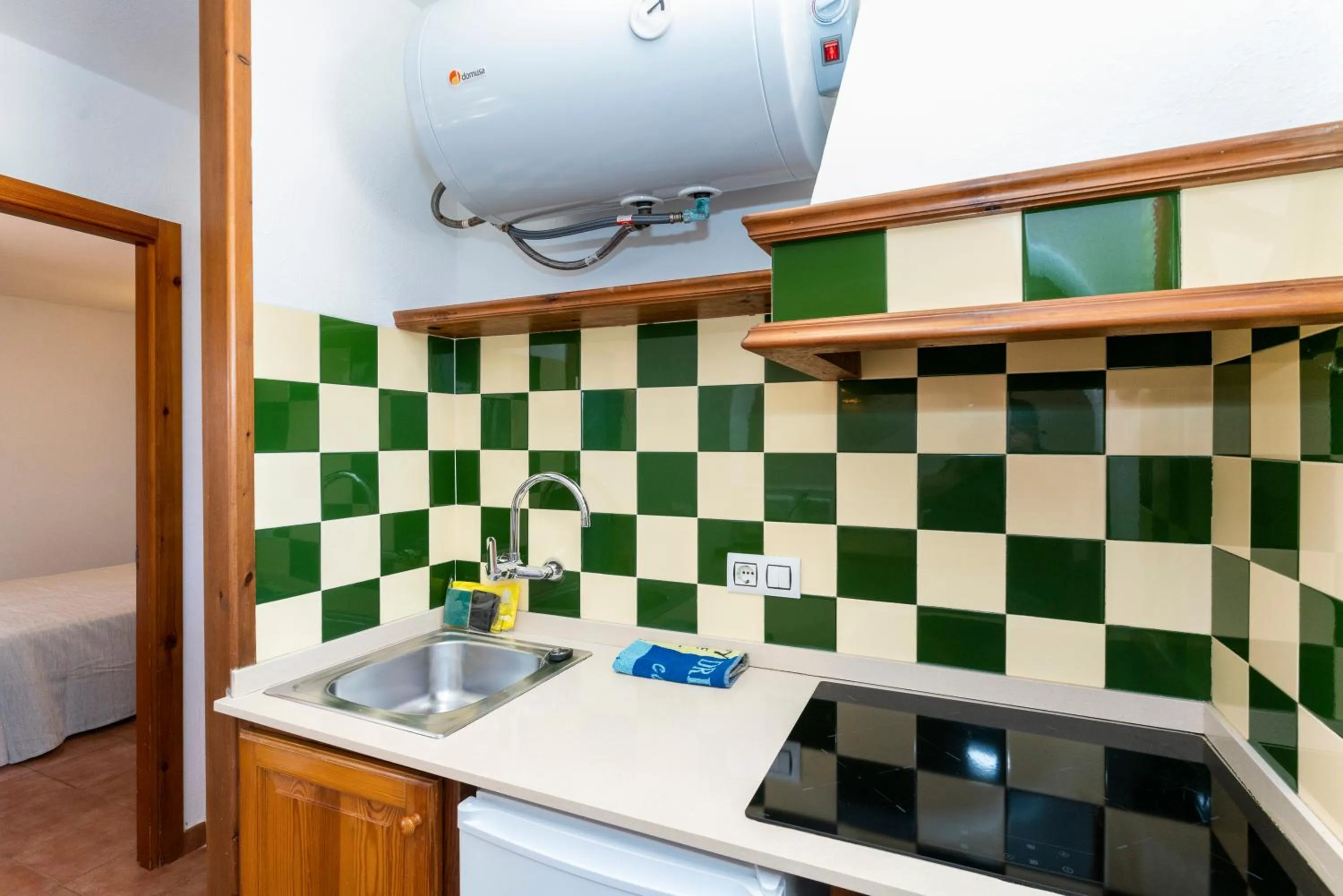Kitchen or kitchenette in Apartamentos Vistapicas